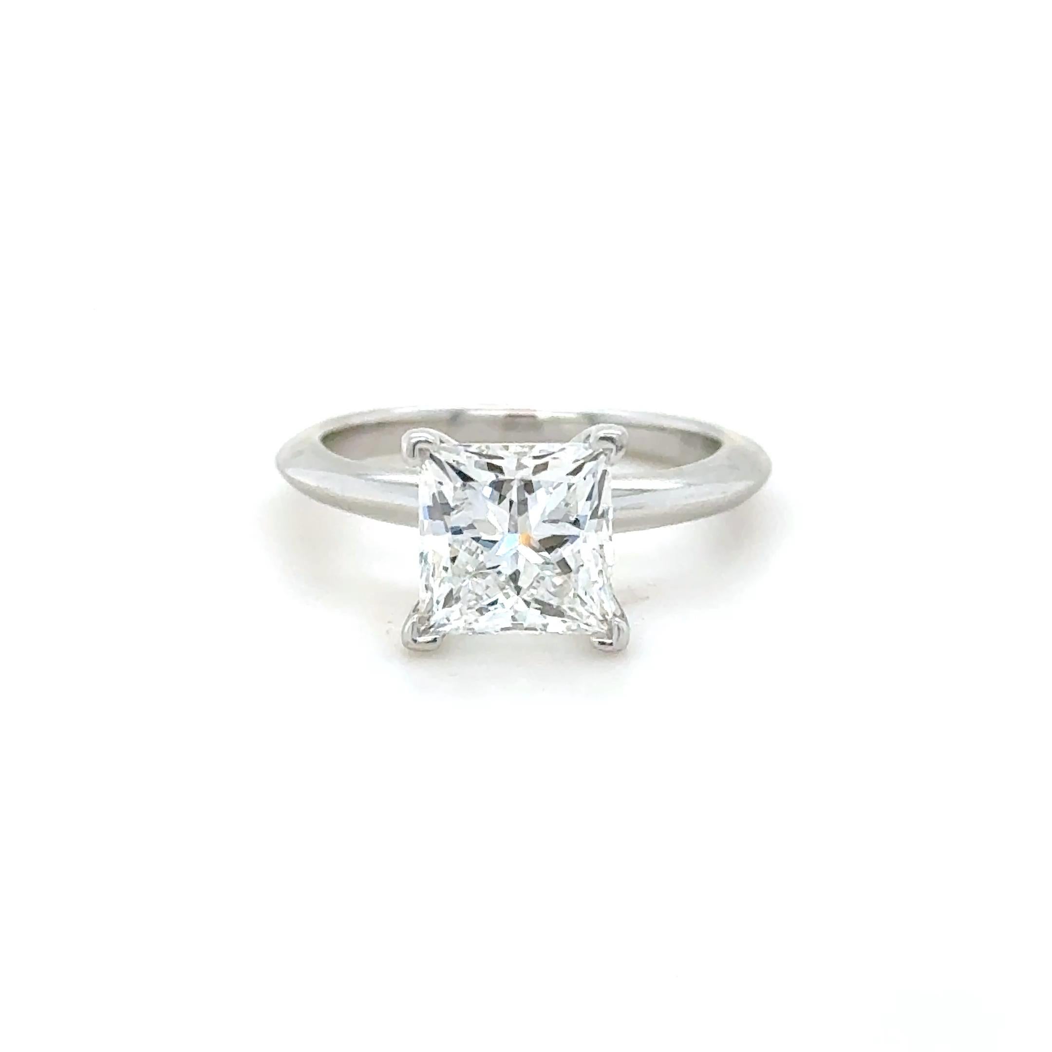 Center Diamond
Diamond cut: Princess
Carat: 1.81 carats
Color: F
Clarity: VVS1
Precision of Cut: Excellent
Polish: Very Good
Symmetry: Very Good
Fluorescence: None
Crown Inscription: T&Co. (Serial Number).

Metal: Platinum
Ring size: 3 3/4
Stamp: