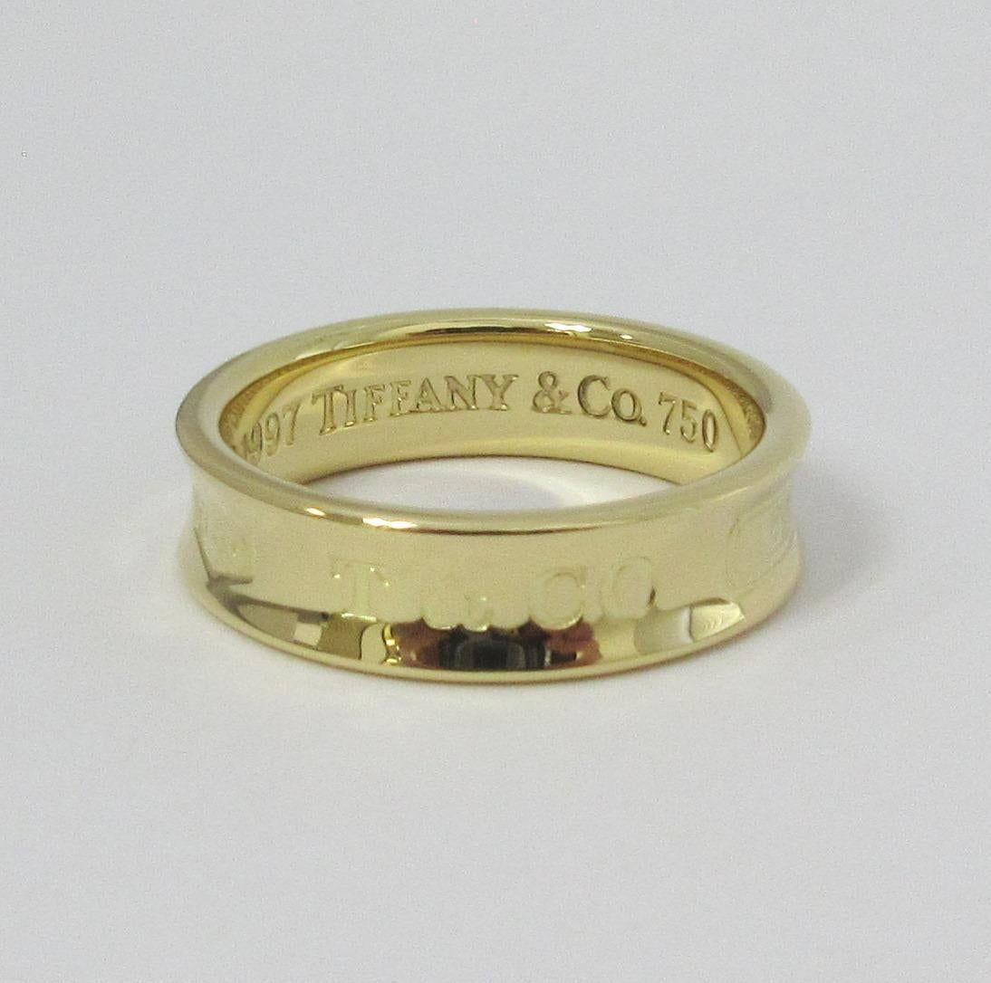 TIFFANY & Co. 1837 18K Gold 6mm Band Ring 9

Metal: 18K yellow gold 
Size: 9
Band Width: 6mm
Weight: 8.70 gram
Hallmark: 
