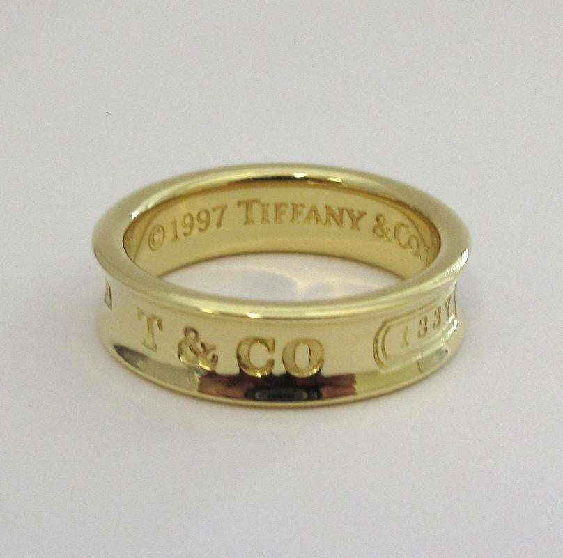 TIFFANY & Co. 1837 18K Gold 6mm Wide Ring 7.5

Metal: 18K yellow gold 
Size: 7.5
Band Width: 6mm
Weight: 8.20 grams
Hallmark: 