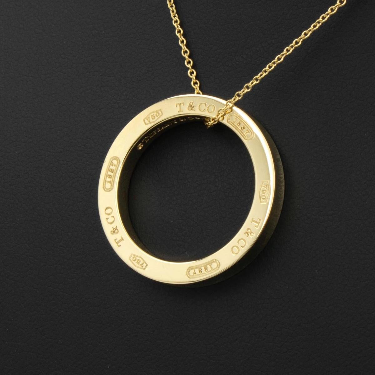 TIFFANY & Co. 1837 18K Gold Circle Pendant Necklace LARGE

Proudly inscribed with the year Tiffany was founded, the Tiffany 1837® collection is defined by sleek curves and contours. Classic and captivating, this pendant is striking in its