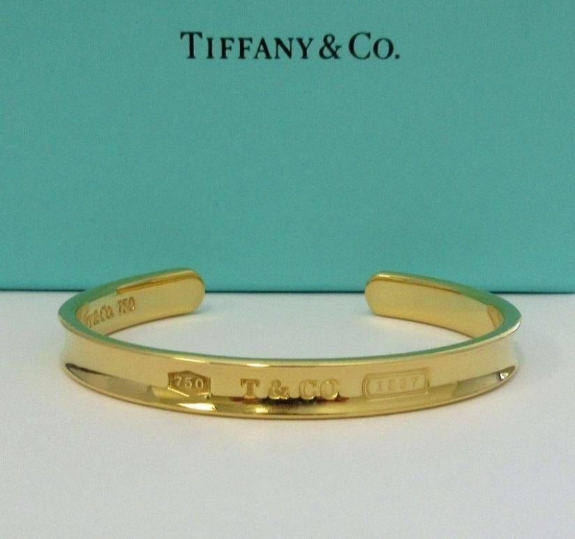 TIFFANY & Co. 1837 18K Gold Cuff Bangle Bracelet

Metal: 18K Gold
Weight: 29.60 grams
Measurement: 2.25