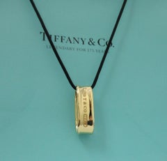 TIFFANY & Co. 1837 18K Gold Loop Pendant Necklace with Silk Cord