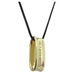 TIFFANY & Co. 1837 18K Gold Loop Pendant Necklace with Silk Cord