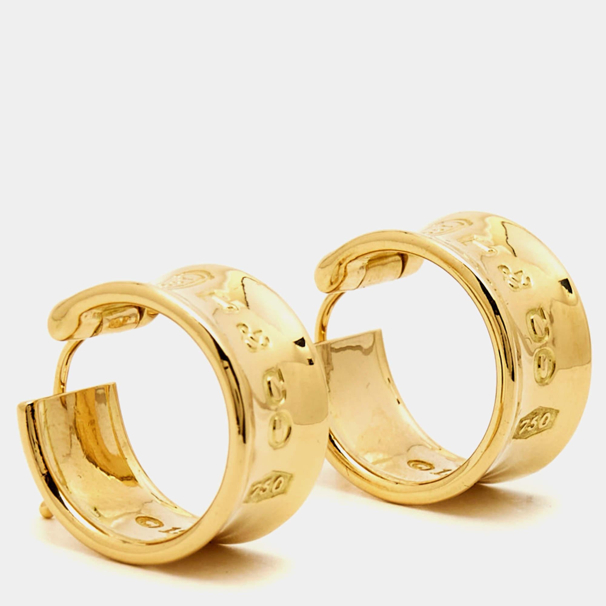 The Tiffany & Co. 1837 earrings are elegant and timeless accessories. Crafted from lustrous 18k yellow gold, these earrings have signature engraving, symbolizing the brand's legacy. Their classic design complements any outfit, making them a