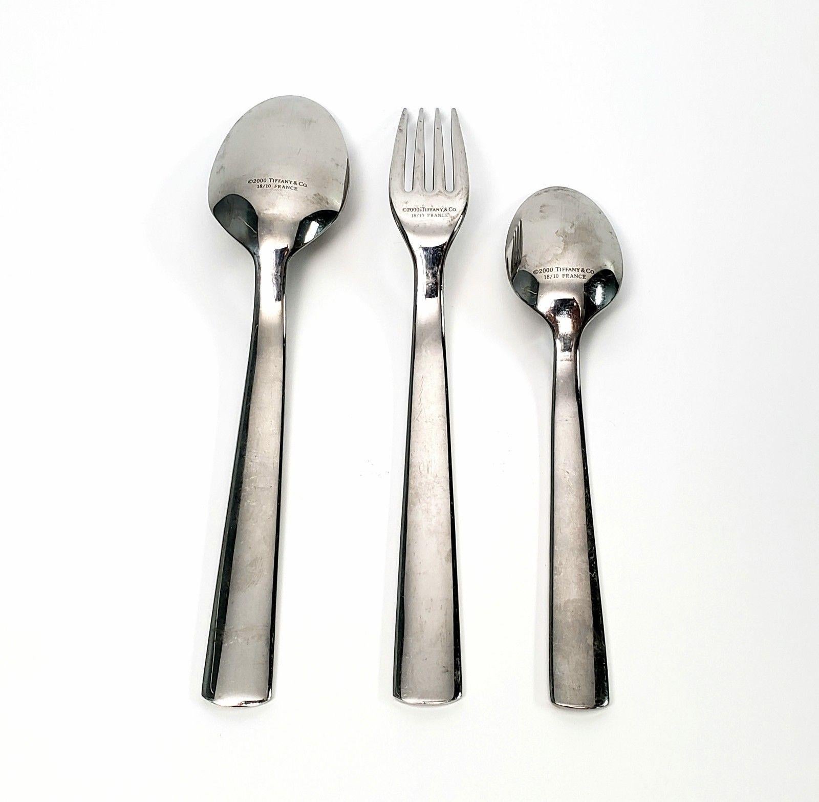 Tiffany & Co. 1837 collection stainless steel 3-piece flatware set including a salad fork, oval soup spoon and teaspoon. No monogram. Marked: 18/10 T&Co 1837 on handle, 2000 Tiffany & C 18/10 France on back. Salad fork: 7 1/8