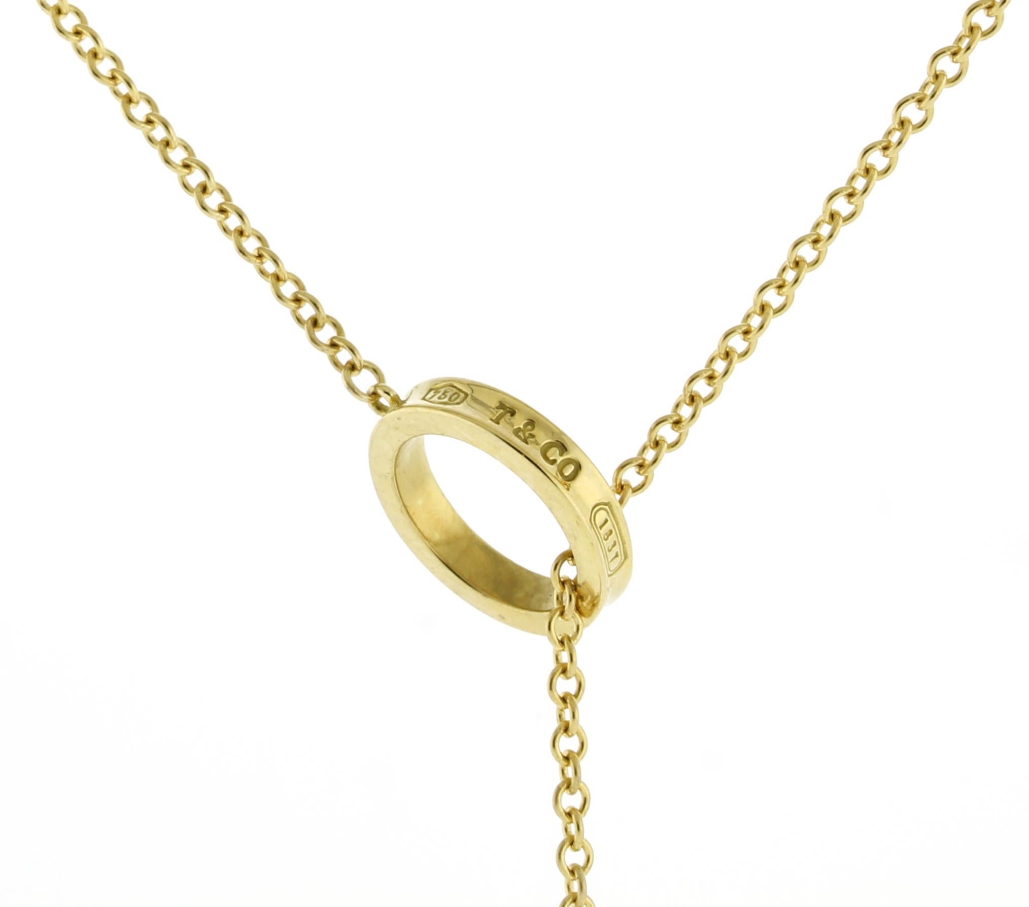 The Tiffany & Co. 1837 Triple Ring Necklace in 18k Yellow Gold is a refined piece from the brand’s iconic “1837” collection, which honors the year Tiffany was established. Known for its sleek, timeless aesthetic, the collection highlights