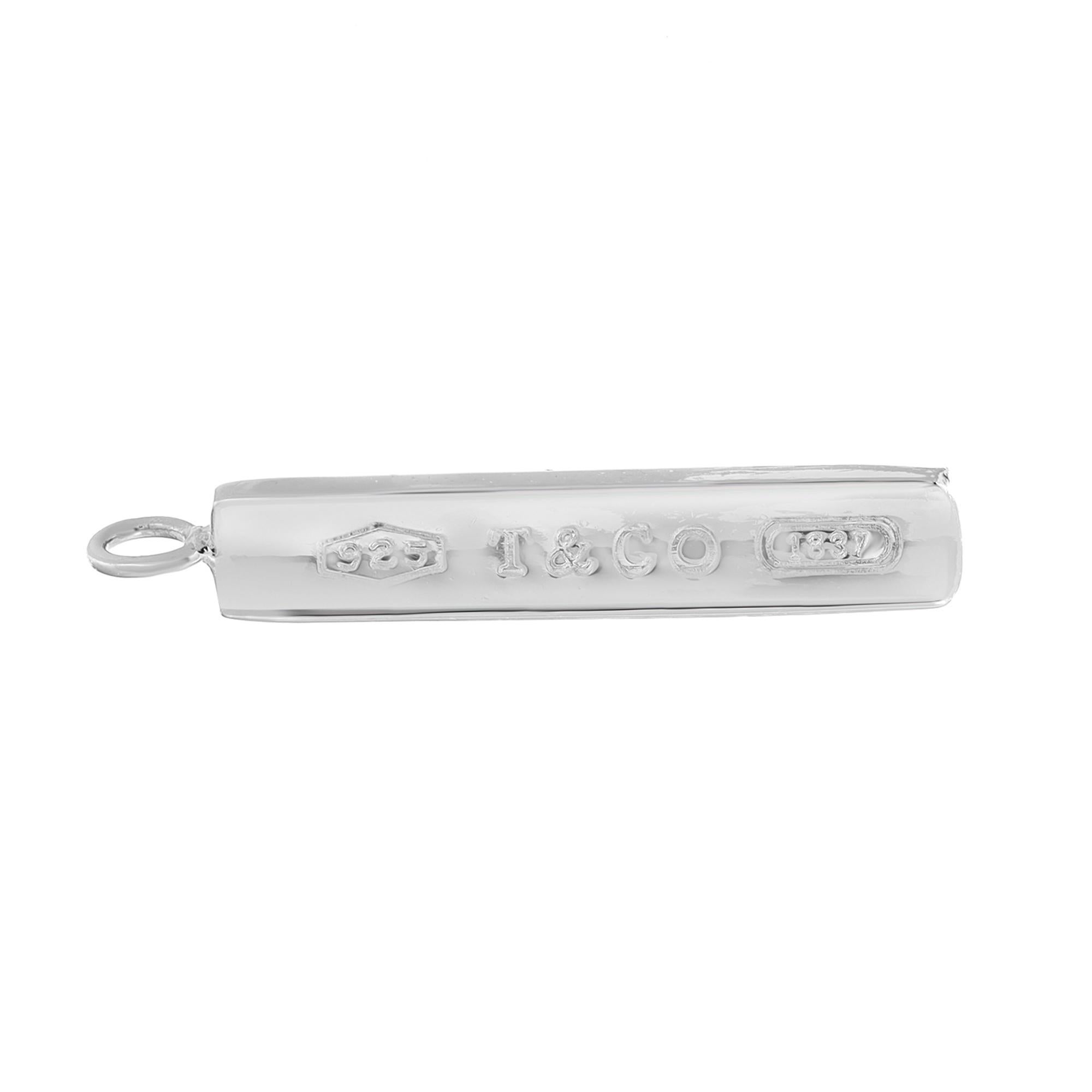 Simple and bold, Tiffany & Co. 1837 long bar pendant designed in highly polished 925 sterling silver. This pendant comes with engraving and is stamped on the front and back. Pendant length: 1.8 Inches. Width: 8mm. Total weight: 6.38 grams. No chain