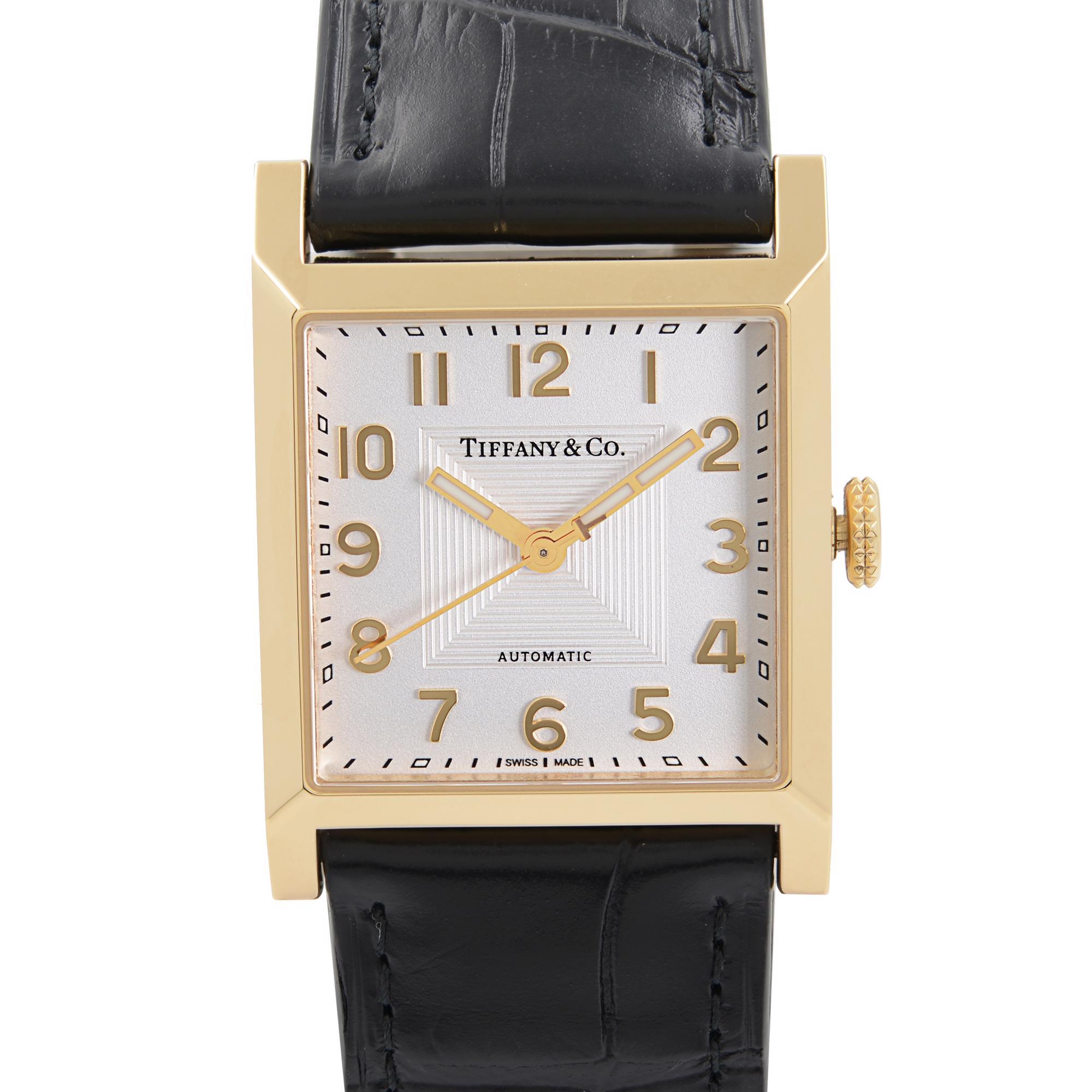 Unworn Tiffany & Co. 1837 Makers 27mm 18k Gold White Dial Automatic Ladies Watch. This Beautiful Timepiece is Powered by a Mechanical (Automatic) Movement with exceptional Features: an 18k Yellow Gold Case with a Black Leather Strap. Fixed 18k