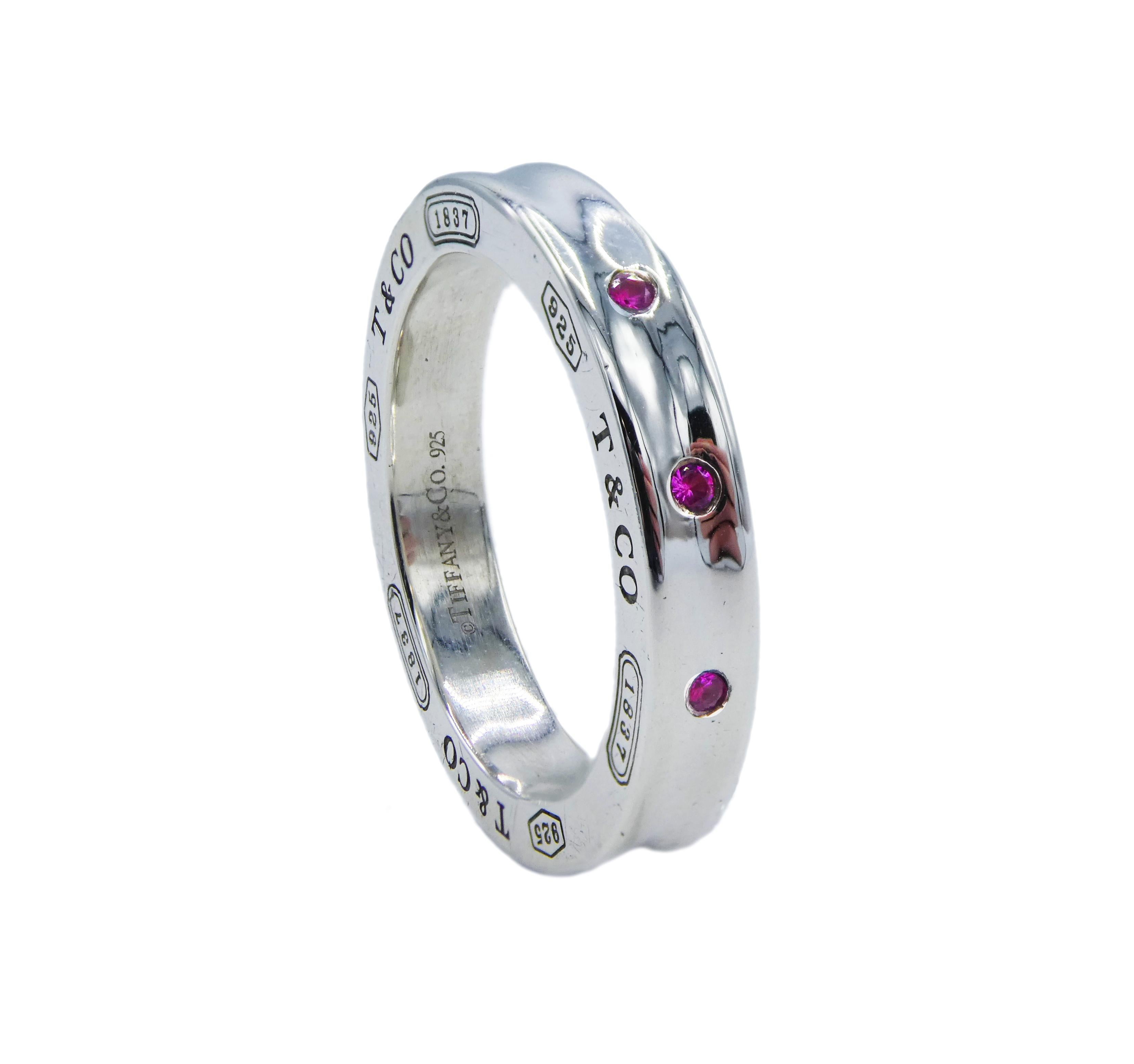 Tiffany & Co. 1837 Pink Sapphire Sterling Silver 925 Band Ring Vintage Size 5.5

Metal: Sterling silver
Weight: 4.82  grams
Stones: 3 Round Cut Pink Sapphires
Finger Size 5.5 (5 1/2) US
Signed: 