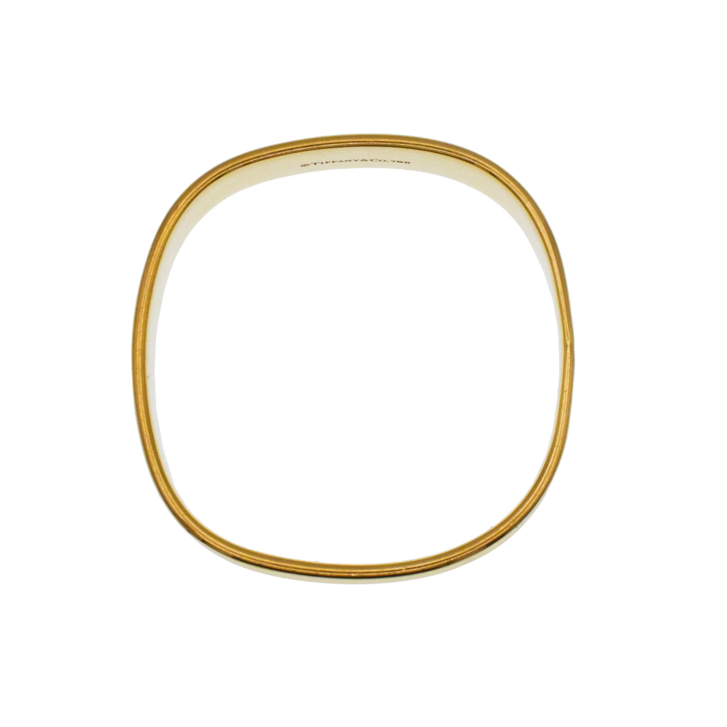 Tiffany & Co. 1837 Square Bangle Bracelet In 18k Yellow
Gold. This bangle is designed in a form of a square cushion.
Outside wall inscribed with 750, T&CO, 1837. Inside wall of the ring
inscribed: Tiffany&Co., 750. Width: 15mm. Inside