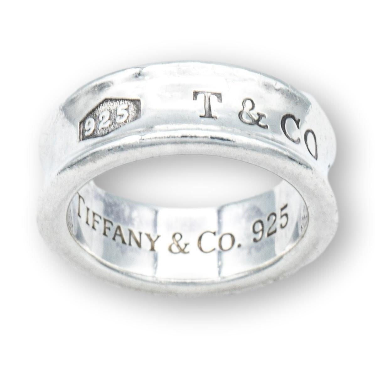Vintage Tiffany & Co. band ring from the 1837 collection finely crafted in fine sterling silver with a contour design measuring 7mm wide. Ring is fully hallmarked.

Ring Specifications

Brand/Collection: Tiffany & Co. 1837
Hallmarks: 925 T & CO.