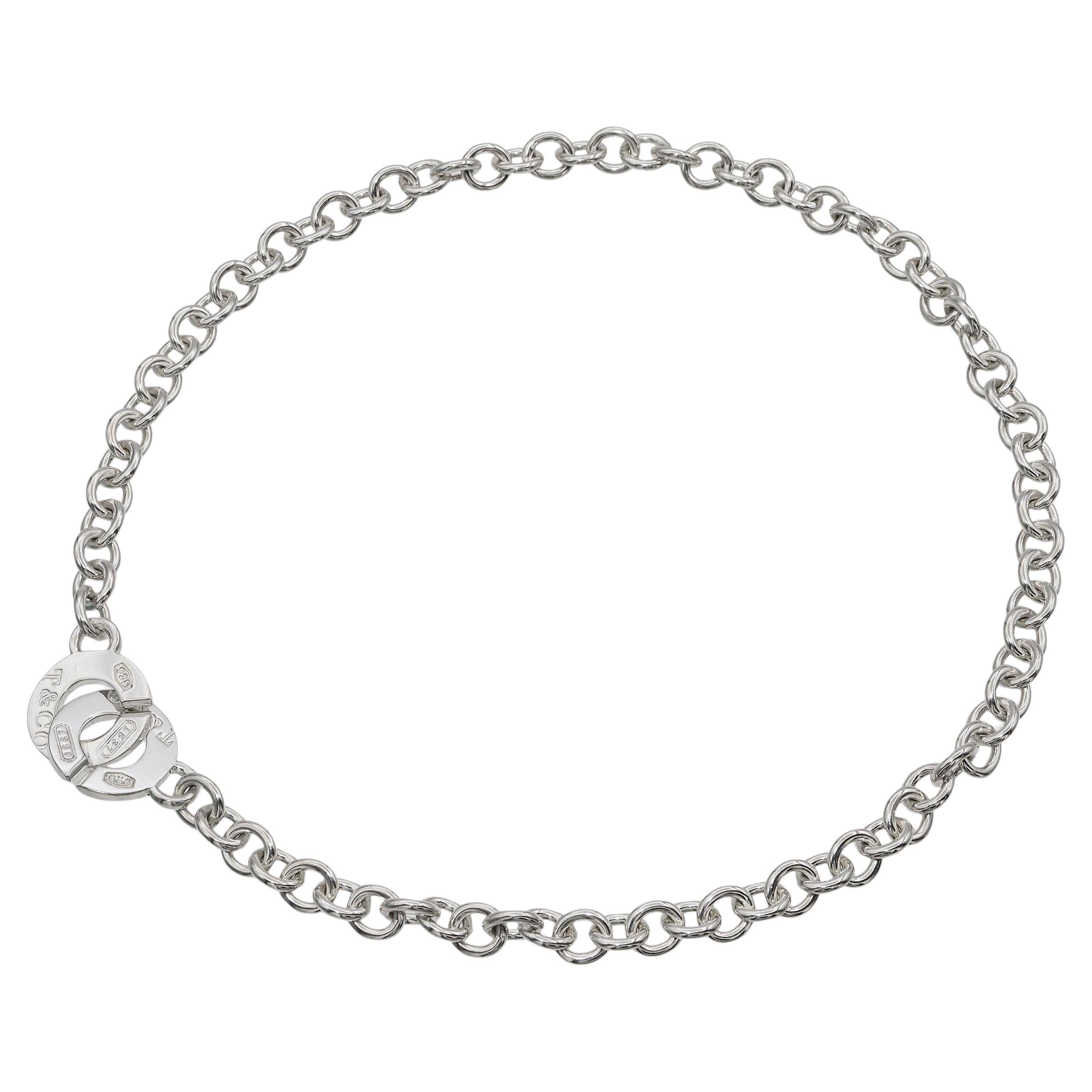 This striking Tiffany & Co. necklace from the 1837 Collection is crafted in sterling silver (.925) and features bold circle links secured with a signature toggle clasp. The toggle is engraved with the Tiffany & Co. 1837 hallmark, commemorating the