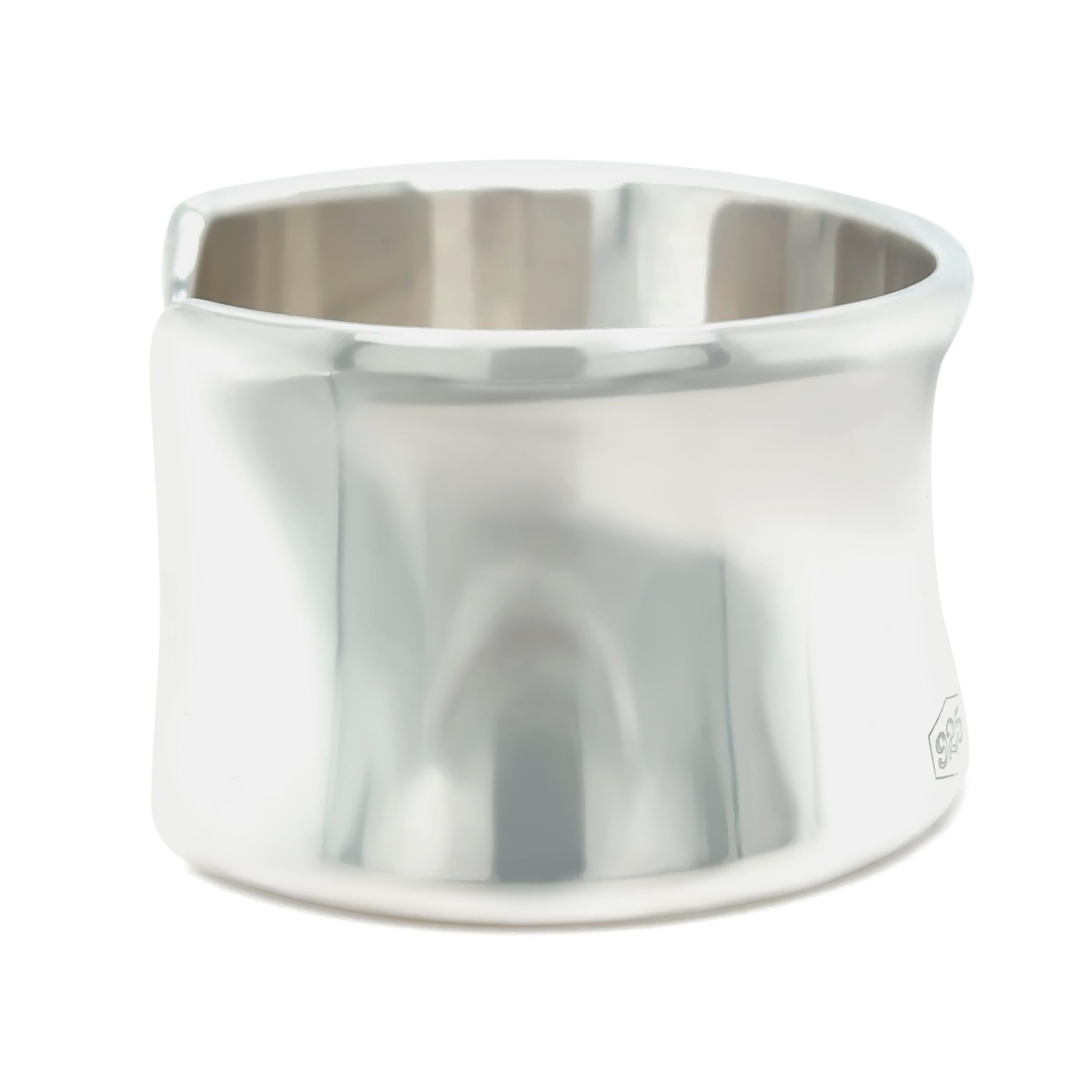 This timeless Tiffany & Co. 1837 cuff bracelet is crafted in sterling silver, featuring the signature curved silhouette and engraved branding from Tiffany’s iconic 1837 collection. Sleek and minimal, it offers effortless elegance for everyday
