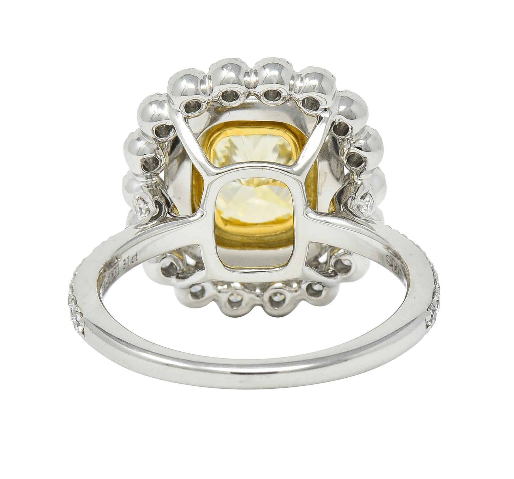 Tiffany & Co. 1.87 CTW Fancy Yellow Diamond Platinum 18 Karat Soleste Halo Ring In Excellent Condition In Philadelphia, PA