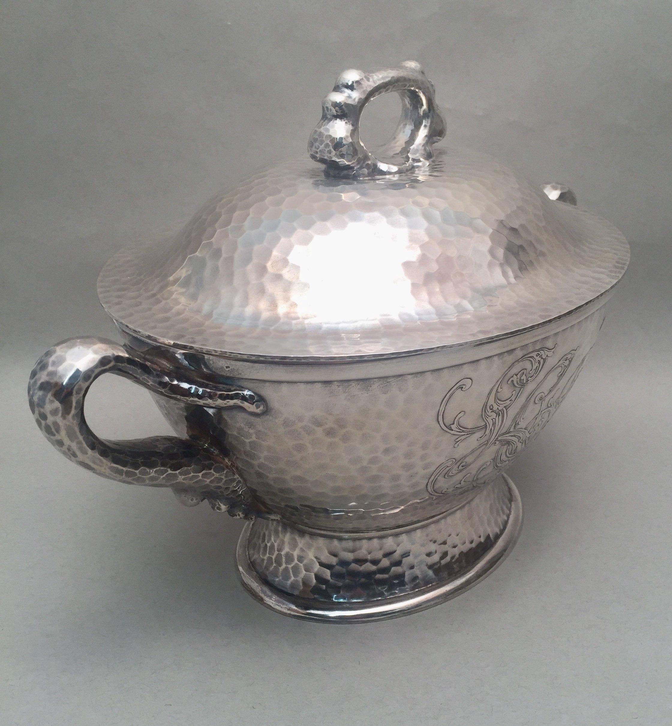 An impressive 1879 decorative sterling silver tureen by the outstanding American maker Tiffany & Co. Designed beautifully in a blunt hand hammered and waved handles, standing on base, special handwork in Japanesque style, which was extremely popular