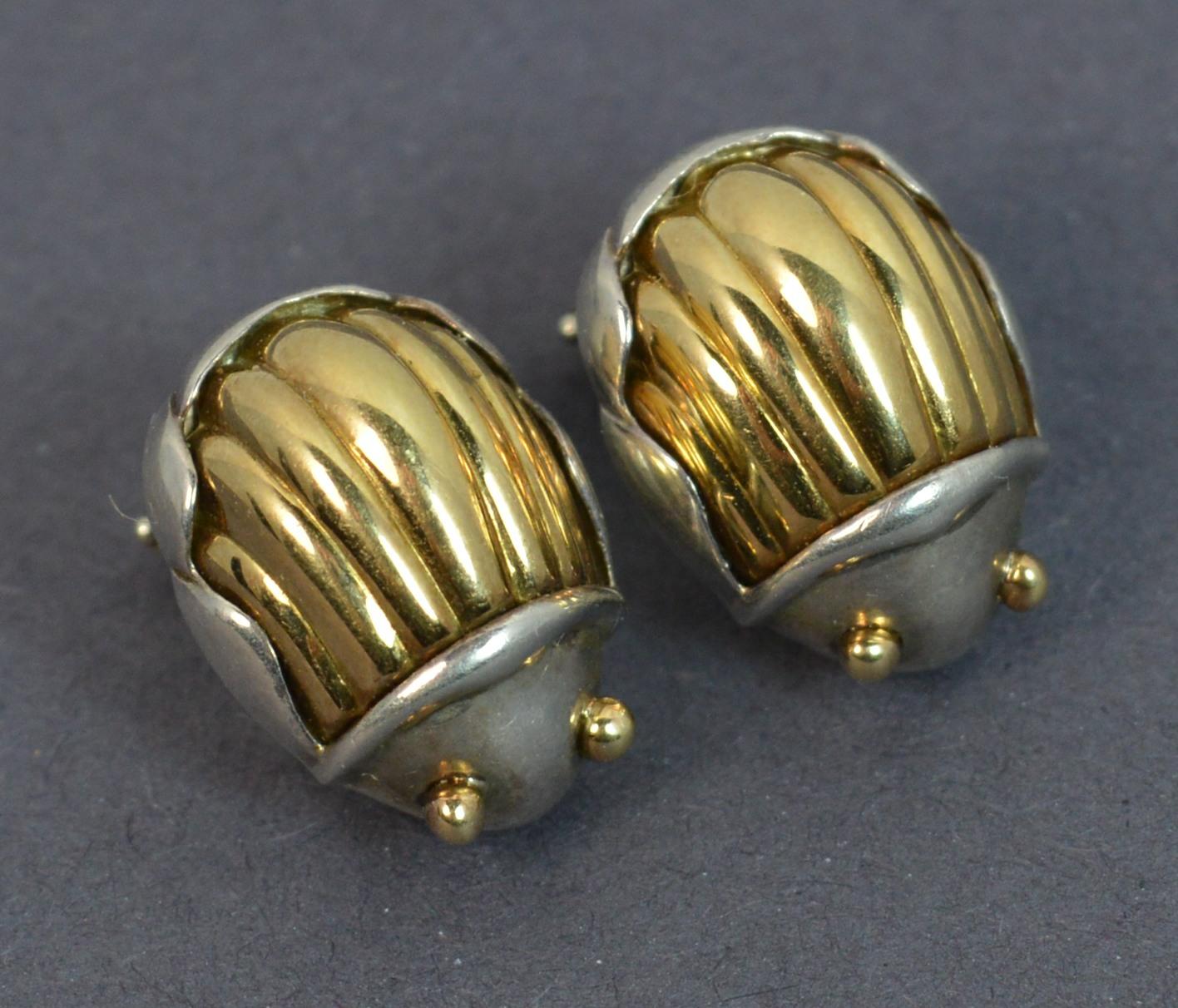 A beautiful vintage pair of earrings.
Designed by TIFFANY & CO.
Sterling silver example with 18 carat yellow gold front.
Scarab beetle design to each.
Hallmarks ; c1993, Tiffany & Co, 925 750
Weight ; 6.4 grams
Size ; 16mm x 11mm beetle,
Condition ;