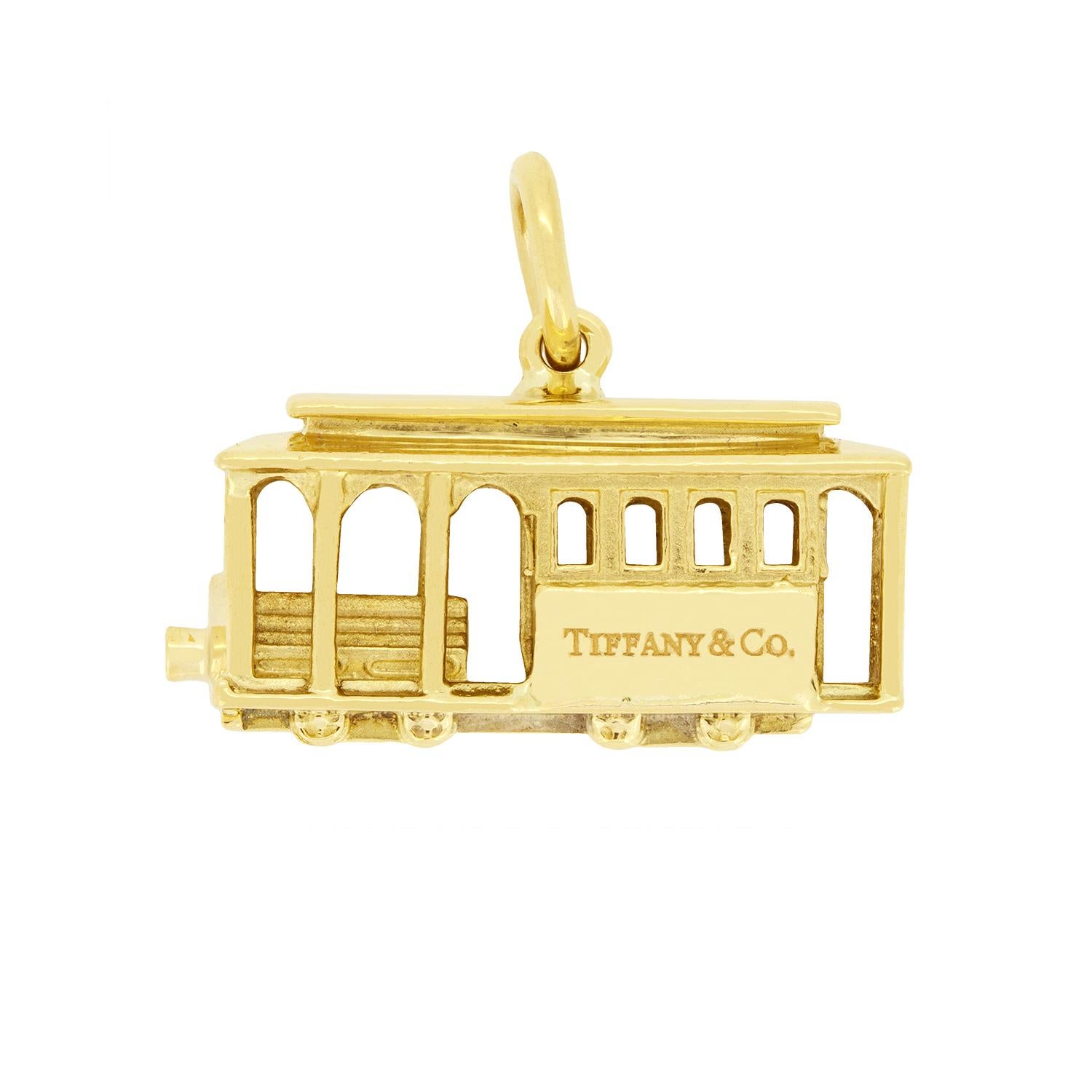 From the designer Tiffany & Co. comes this sweet Tram charm. Created in 18 carat yellow gold the tram cart is 11 grams in weight. A single round brilliant diamond sits at the front of the Tram cart adding wonderful detailing. The 0.01 carat diamond