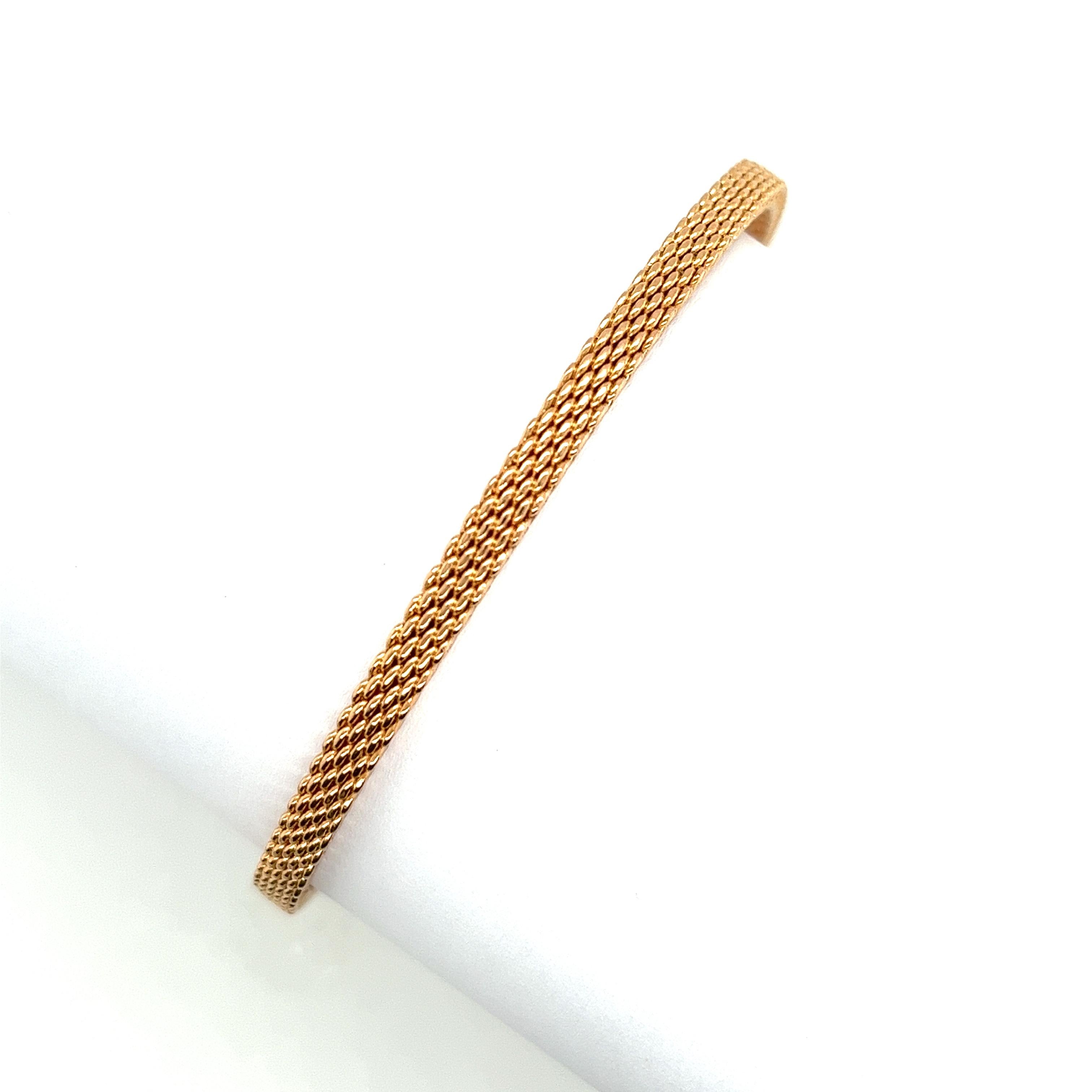 Indulge in luxury with the Tiffany & Co 18ct Rose Gold Somerset Mesh Bangle Bracelet. 
Crafted with exquisite precision and attention to detail, this stunning bracelet features a delicate mesh design that exudes elegance and sophistication. 

Made