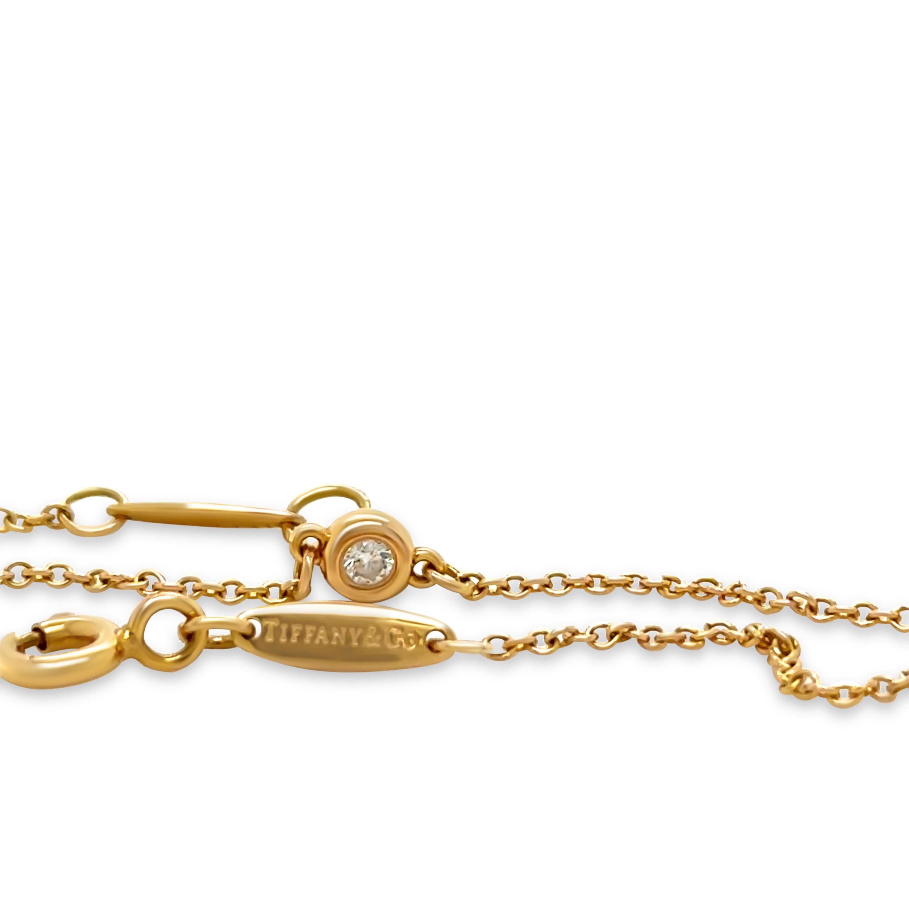 This elegant Tiffany & Co. Diamonds by the Yard® bracelet, designed by Elsa Peretti, is crafted in 18ct yellow gold and features a single round brilliant-cut diamond in a delicate bezel setting. The 0.03ct diamond shimmers beautifully against the