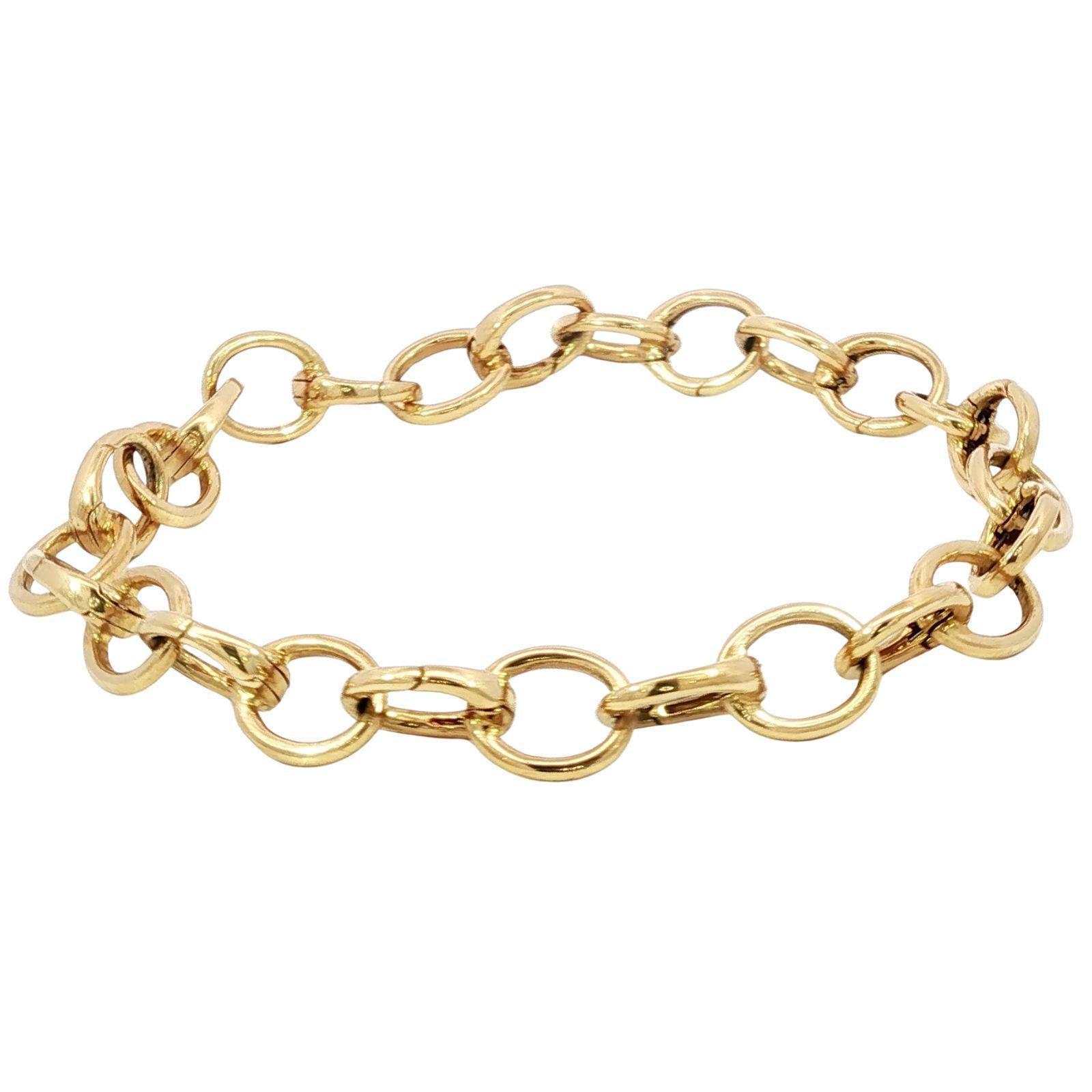 Tiffany & Co. 18K Clasping Charm Bracelet Or Jaune 13 Charm Links 7.25