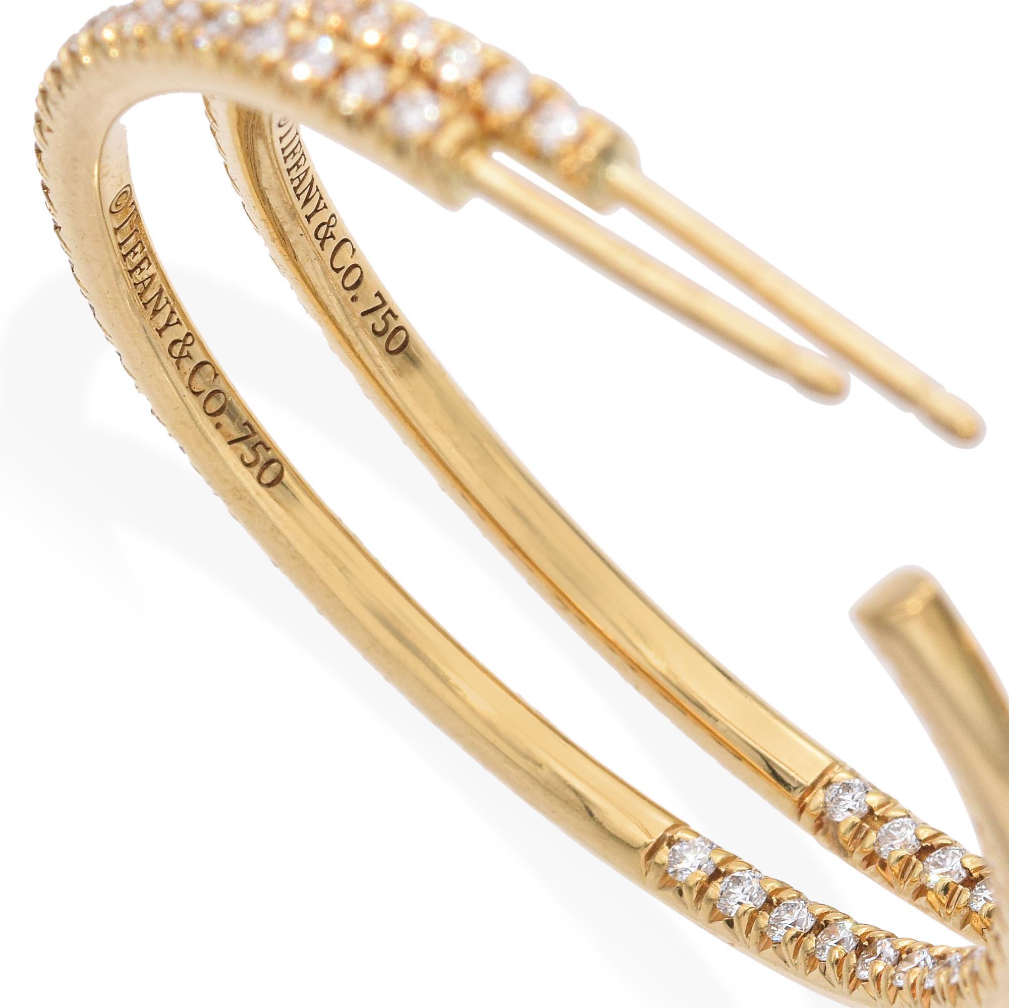 This is uncomplicated glamour at its finest. Perfect for day or night, the Tiffany Metro collection features graceful forms paved with superbly cut diamonds for sparkle that rivals the starriest sky.

Weight: 8 grams 
Stone: .74tcw 
Stone Grade: G-H
