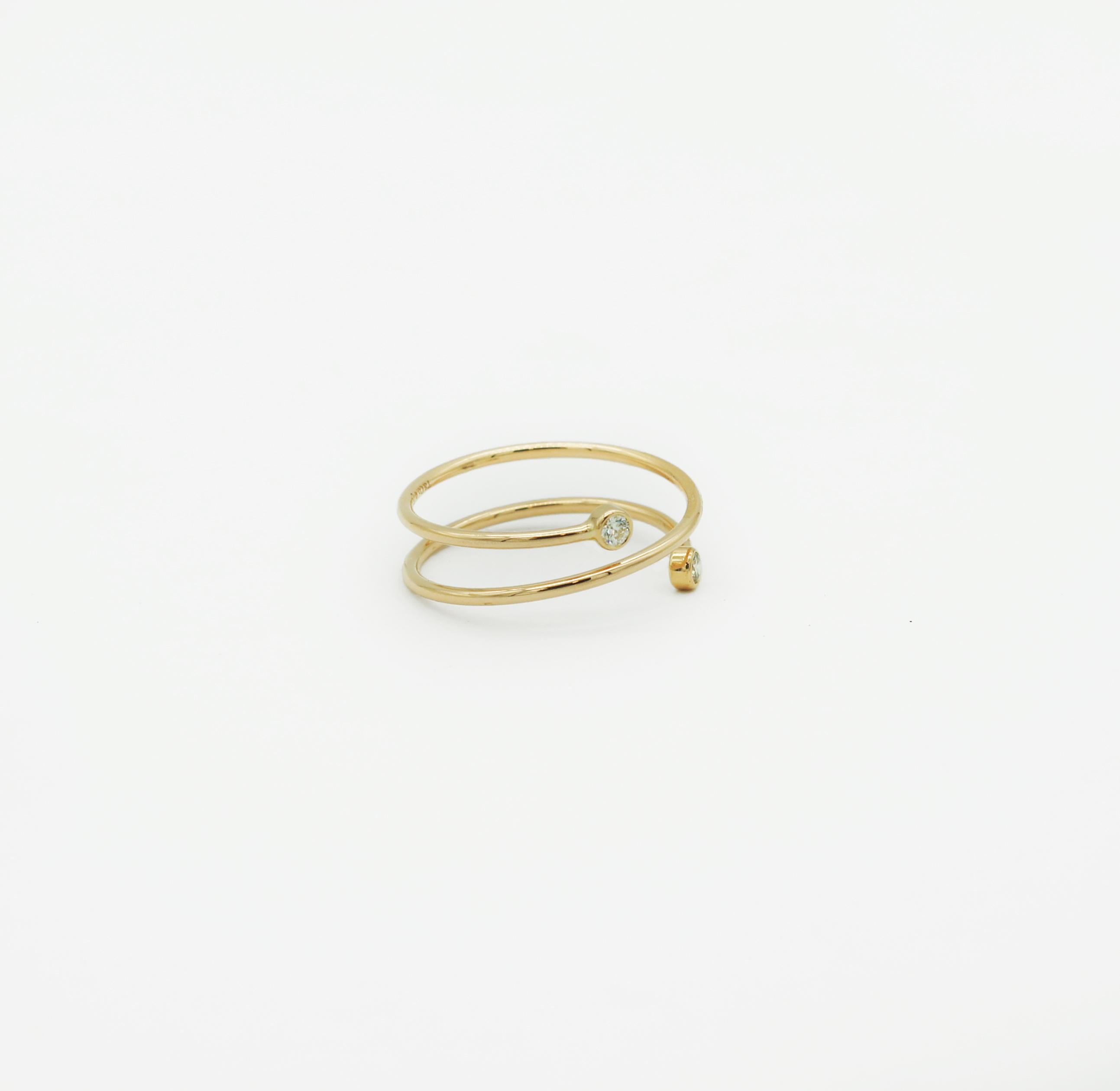 Tiffany & Co.
18k Gold
Double spring Hoop Ring
Hallmarked: (c)T&Co Elsa Peretti Au750
Size 8.5 (US)
2 round brilliant diamonds
Approx. Carat total weight; .10
Inspired by linear beauty, the Diamond Hoop collection epitomizes modern simplicity. Here,