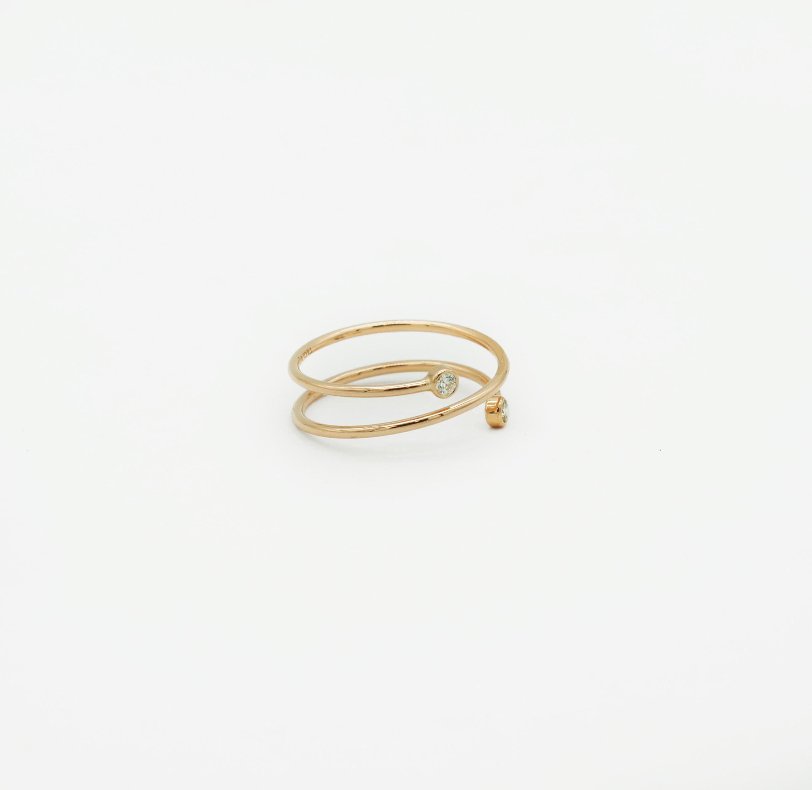 Tiffany & Co.
Rose 18k Gold
Double spring Hoop Ring
Hallmarked: (c)T&Co Elsa Peretti Au750
Size 7.5 (US)
2 round brilliant diamonds
Approx. Carat total weight .10
Inspired by linear beauty, the Diamond Hoop collection epitomizes modern simplicity.