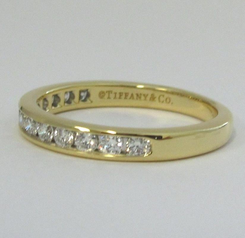 TIFFANY & Co. 18K Gold 3mm Half Circle Diamond Wedding Band Ring 7.5 

Metal: 18K yellow gold  
Size: 7.5 
Band Width: 3mm
Weight: 3.80 grams
Diamond: 13 round brilliant diamonds, carat total weight .39 
Hallmark: ©TIFFANY&Co. AU750
Condition: