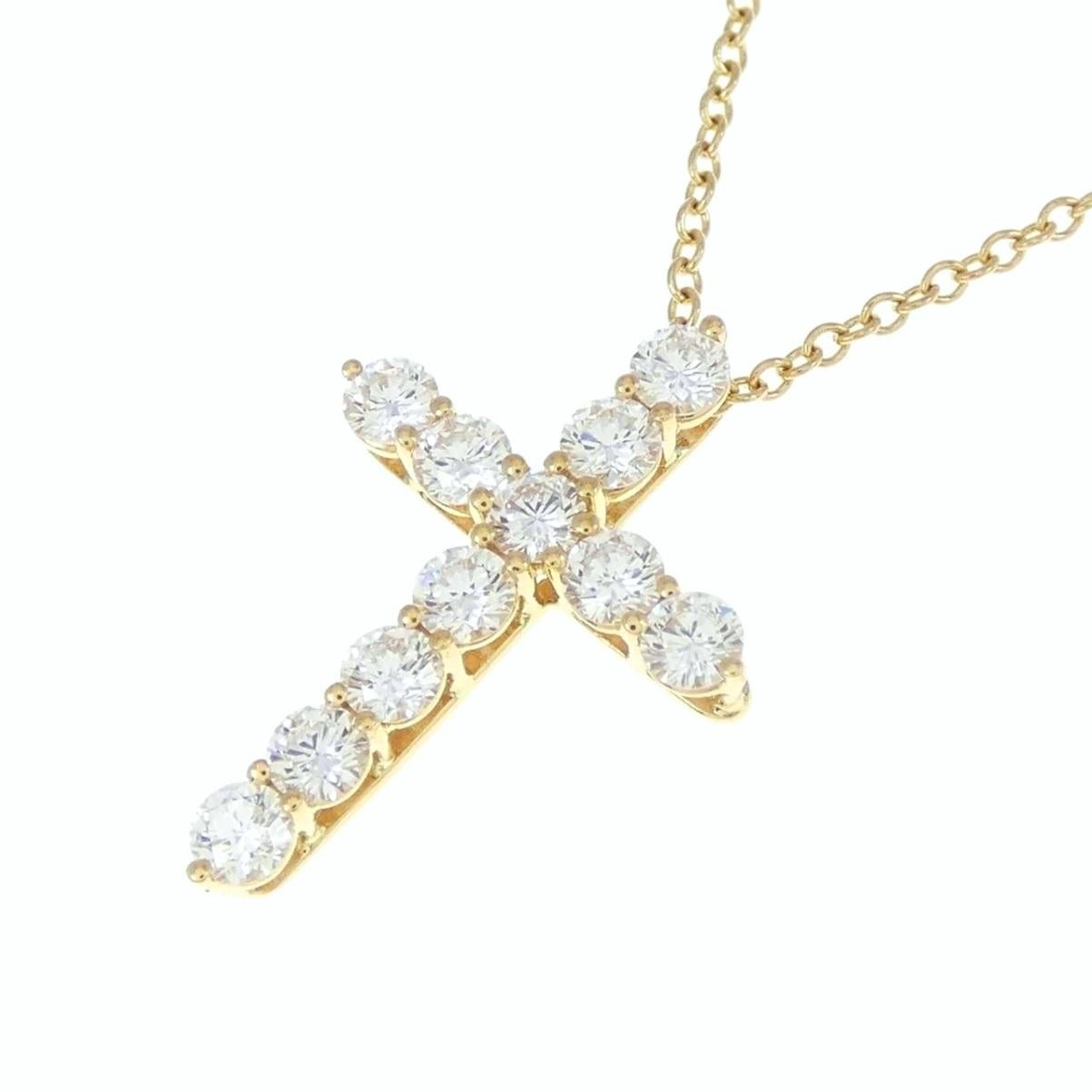 TIFFANY & Co. Collier pendentif croix en or 18K avec diamant de 0,42ct

Métal : Or jaune 18K
Chaîne : 16