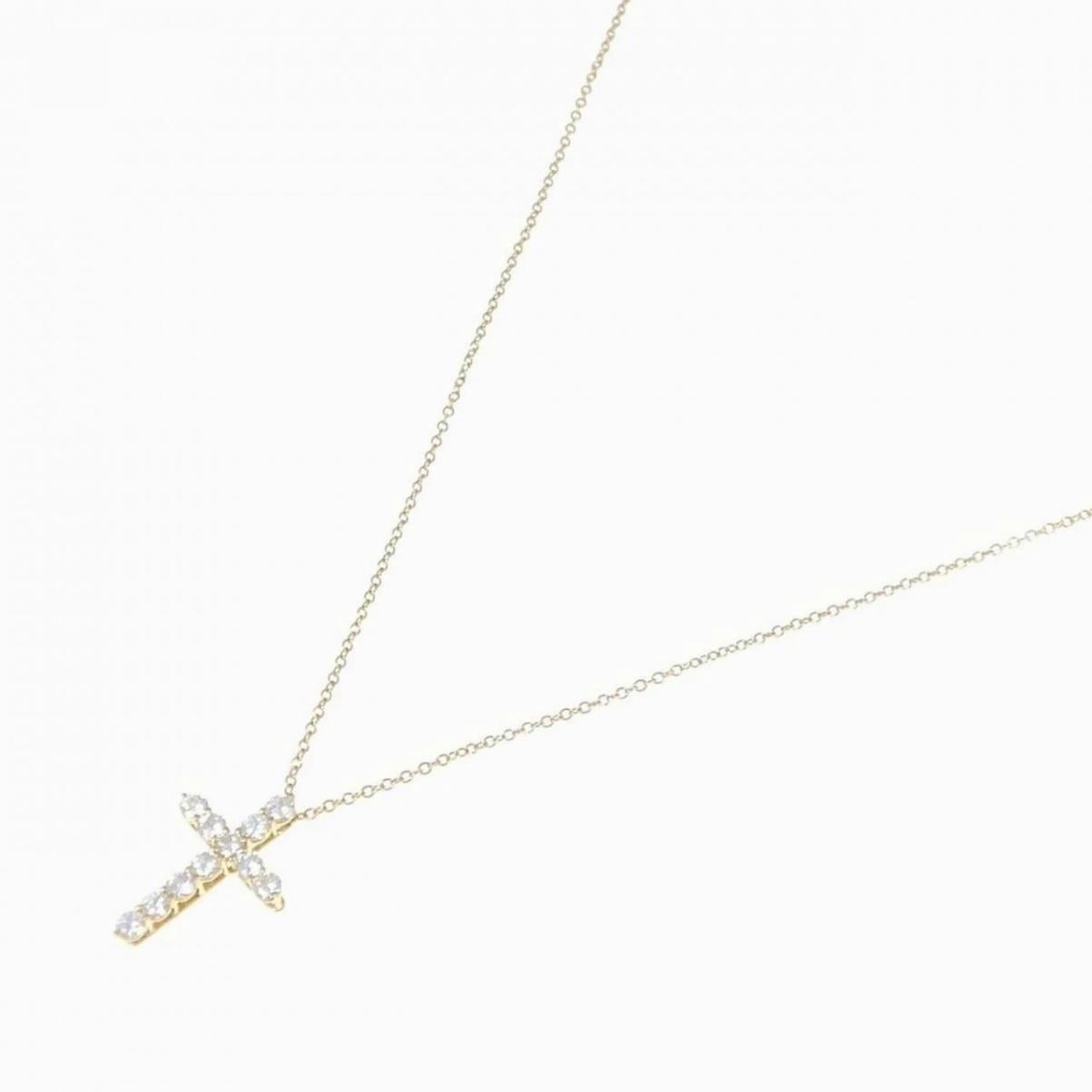 TIFFANY & Co. Collier pendentif croix en or 18K avec diamant de 0,42ct Excellent état - En vente à Los Angeles, CA