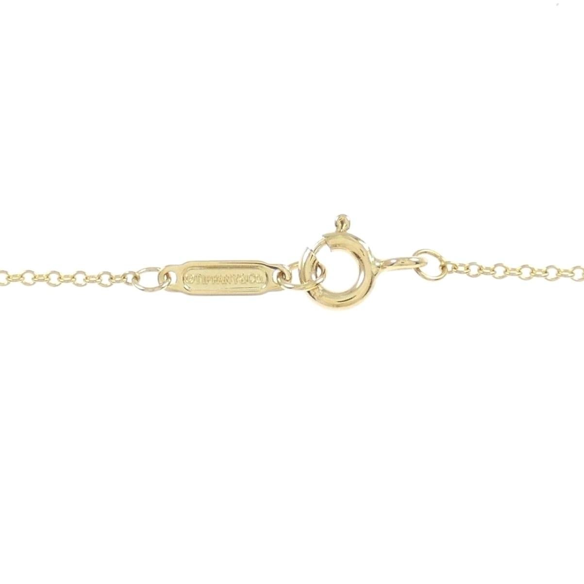 Collana con croce di diamanti TIFFANY & Co. in oro 18 carati da 0,42 carati in vendita 1