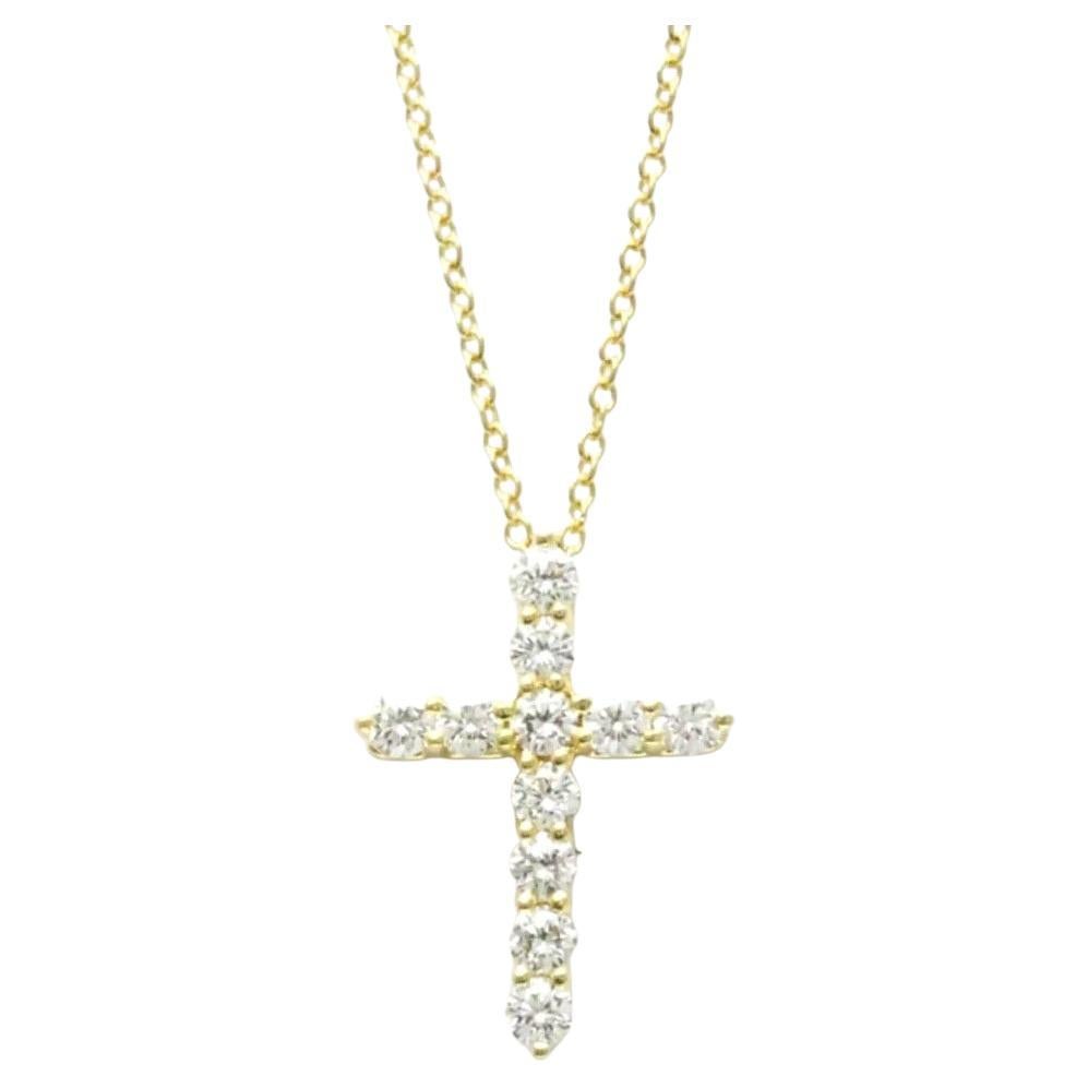 TIFFANY
Co. Collier pendentif croix en or 18K avec diamant de 0,42ct