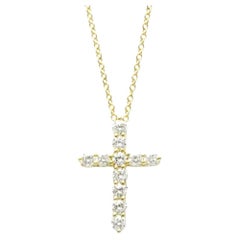 TIFFANY
Co. Collier pendentif croix en or 18K avec diamant de 0,42ct