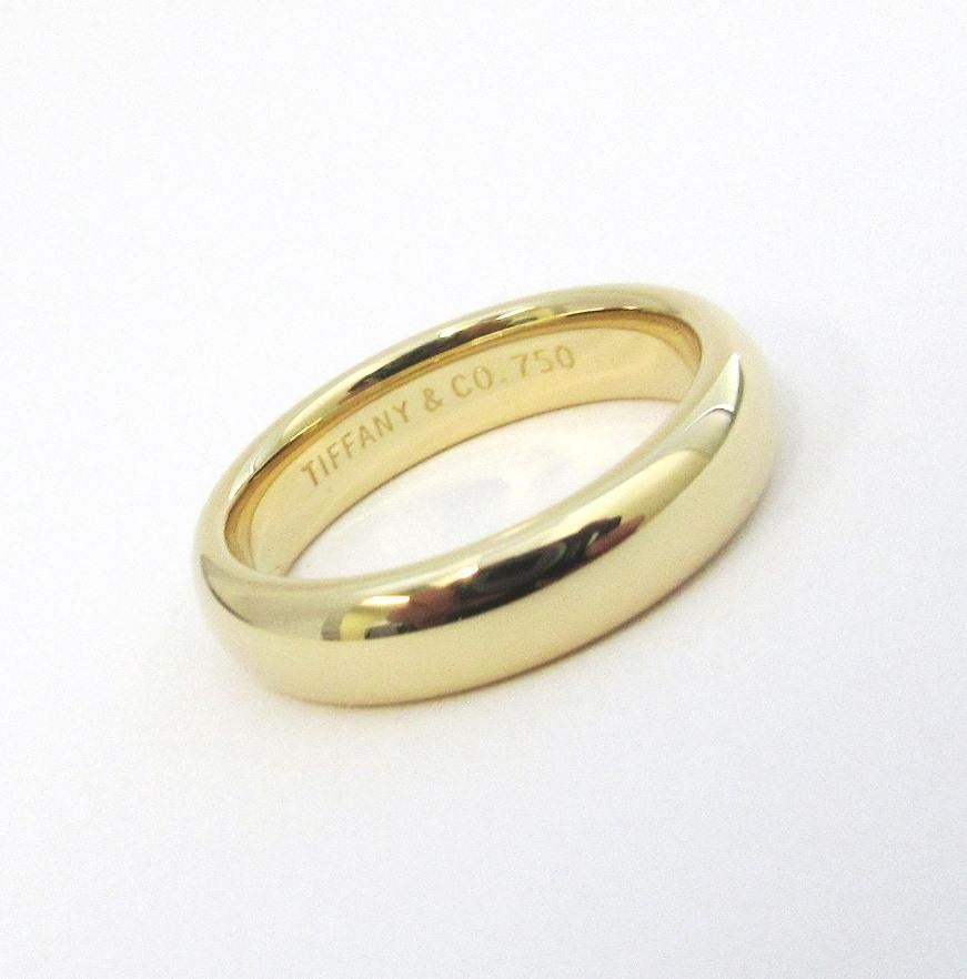 TIFFANY & Co. 18K Gold 4.5mm Comfort Fit Wedding Band Ring 4.5

 Metal: 18K yellow gold 
 Size: 4.5 
 Band Width: 4.5mm
 Weight: 5.80 grams
 Hallmark: TIFFANY&CO. 750
 Condition: Excellent condition, like new

Limited edition, no longer available