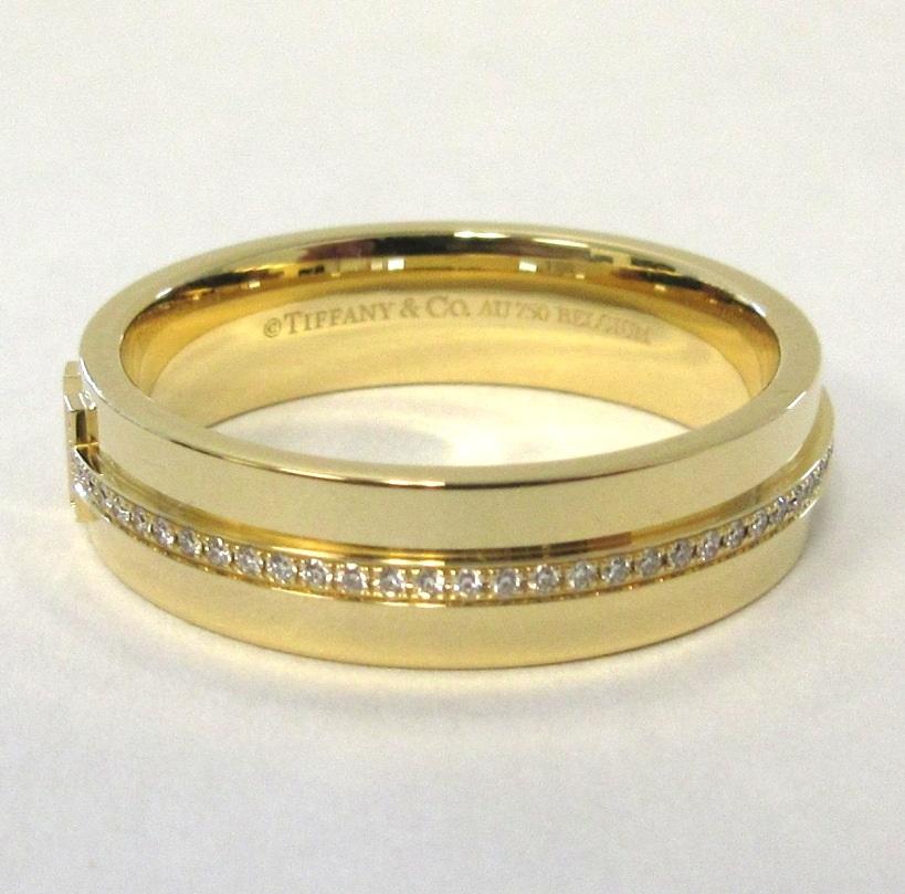 Round Cut TIFFANY & Co. 18K Gold 5.5mm Wide Diamond T Ring 9 For Sale