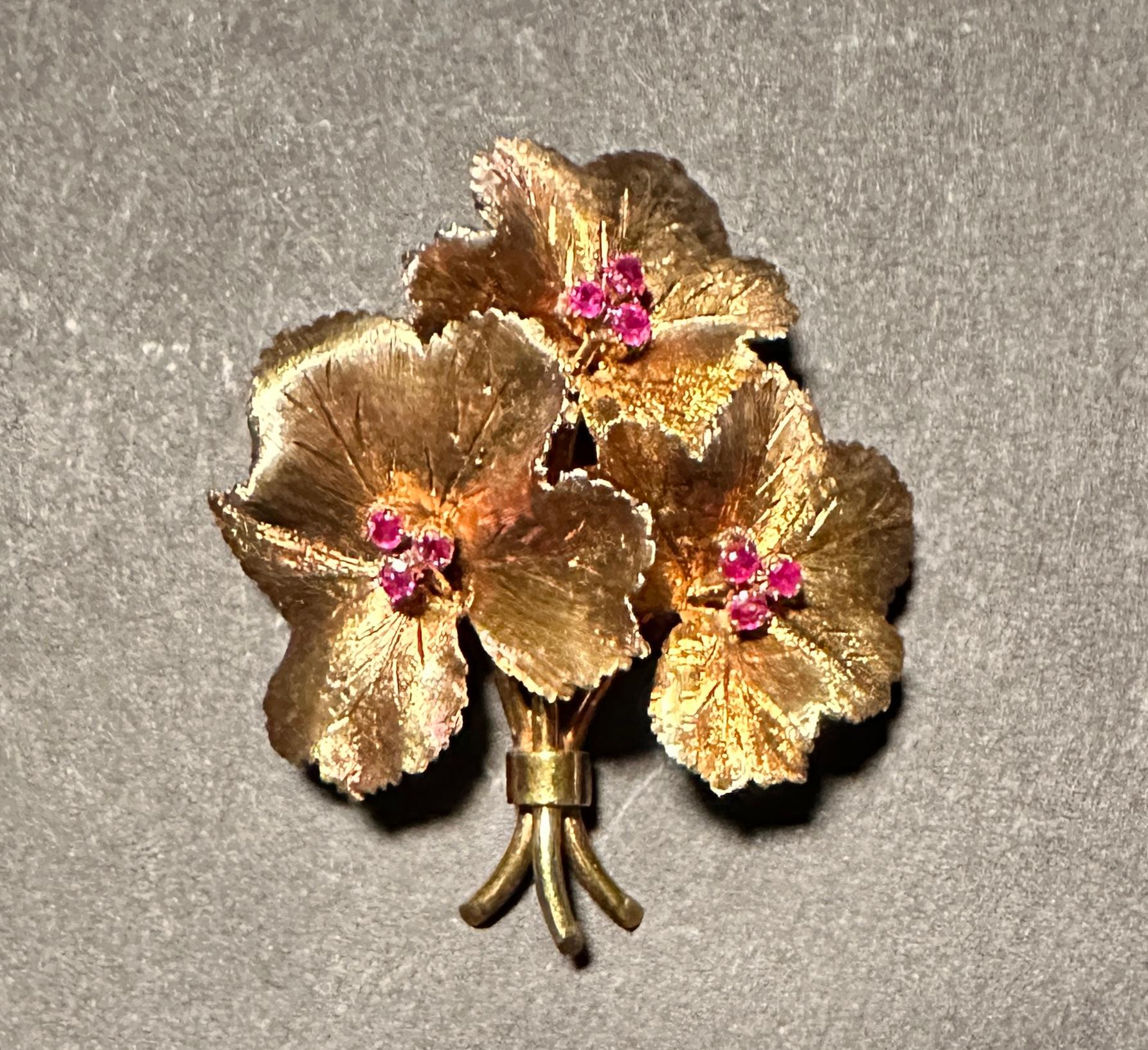 Tiffany & Co. vintage 18K yellow gold and ruby leaf form pin brooch. 18k yellow gold with a florentine satin finish and 9 prong set round rubies. The leave patterns preserve the original patina and texture. Made in Italy. Fully marked Tiffany & Co.