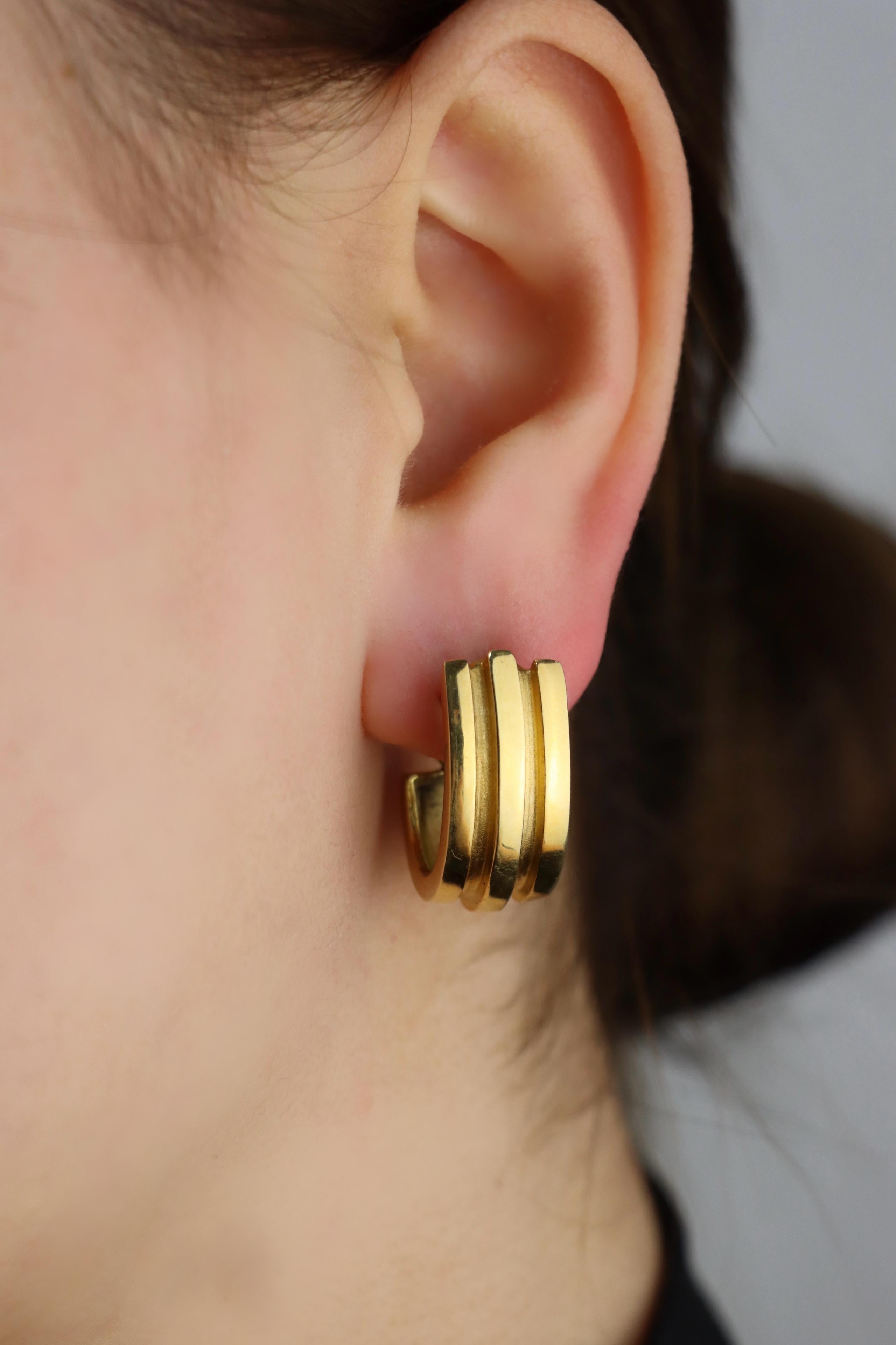 Tiffany & Co. 18K Gold Atlas Hoop Earrings

Marked:
Tiffany & Co
750
1995

Approximate Dimensions:
2.2 cm (Length) 
1 cm (Width)
23.3 grams in weight.