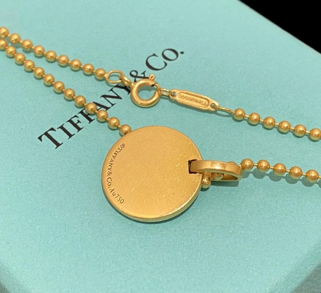 TIFFANY & Co. Collier à pendentif circulaire en or 18K à pointe de diamant 24