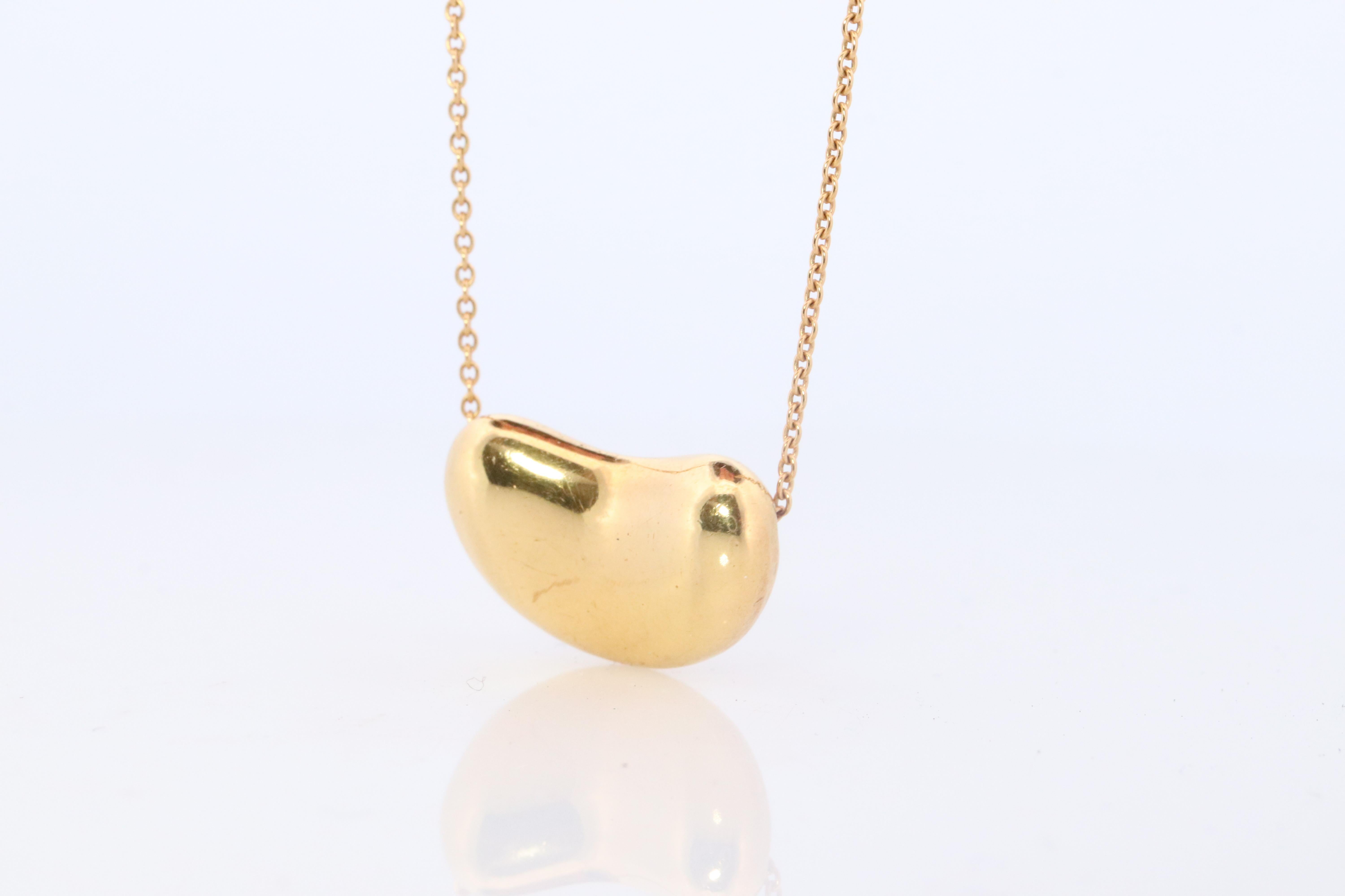 Modern Tiffany & Co. 18k Gold Chain and Bean Pendant Necklace. 750 Yellow Gold Tiffany For Sale