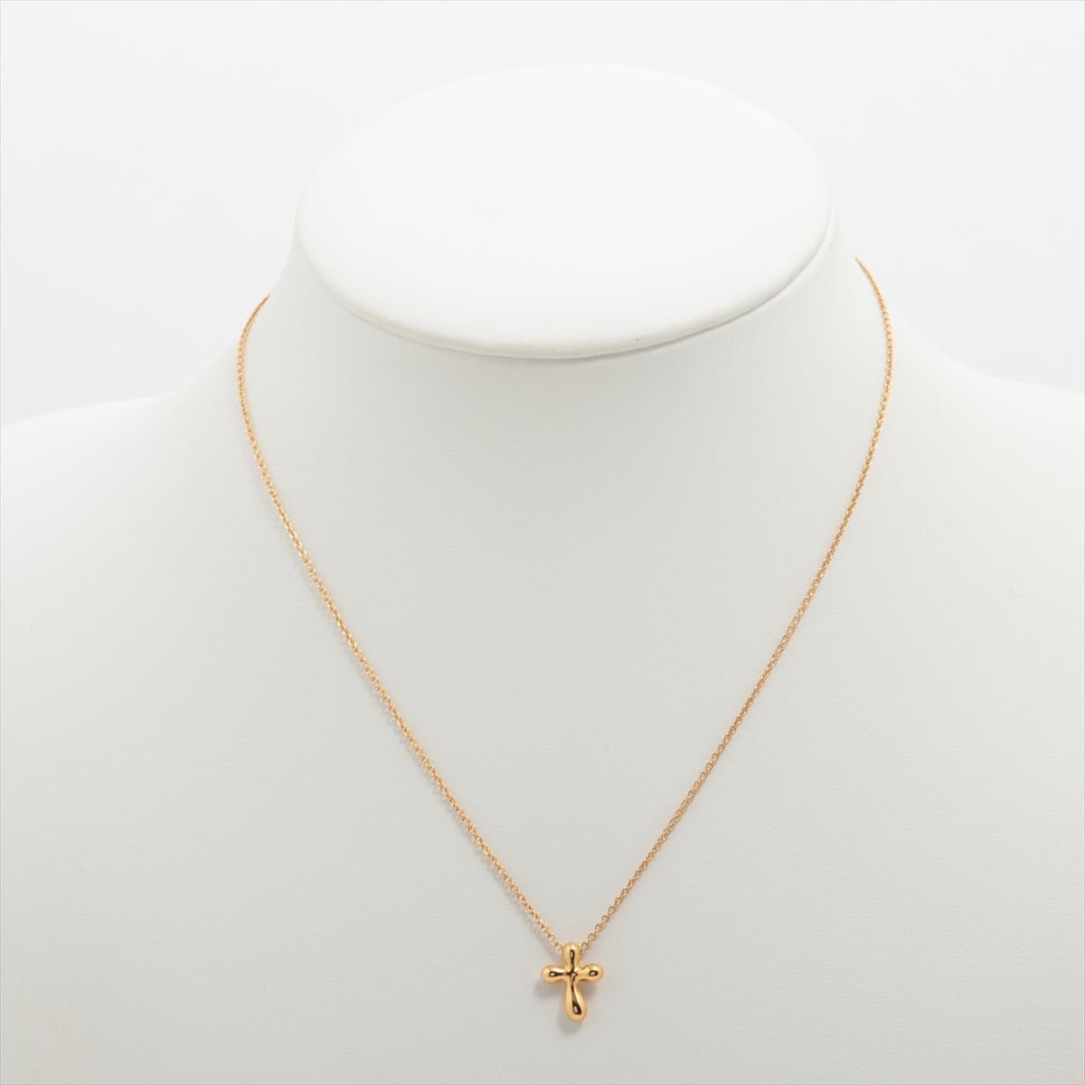 Lovely Find. PRE-OWNED 18kt Yellow Gold pendant with 18kt Yellow Gold Chain.
The piece is designed by Elsa Peretti and made by Tiffany & Co.

18k 750 Crucifix Cross Pendant.

Chain is marked 750, Tiffany & Co., Spain, Peretti. 16 inches in