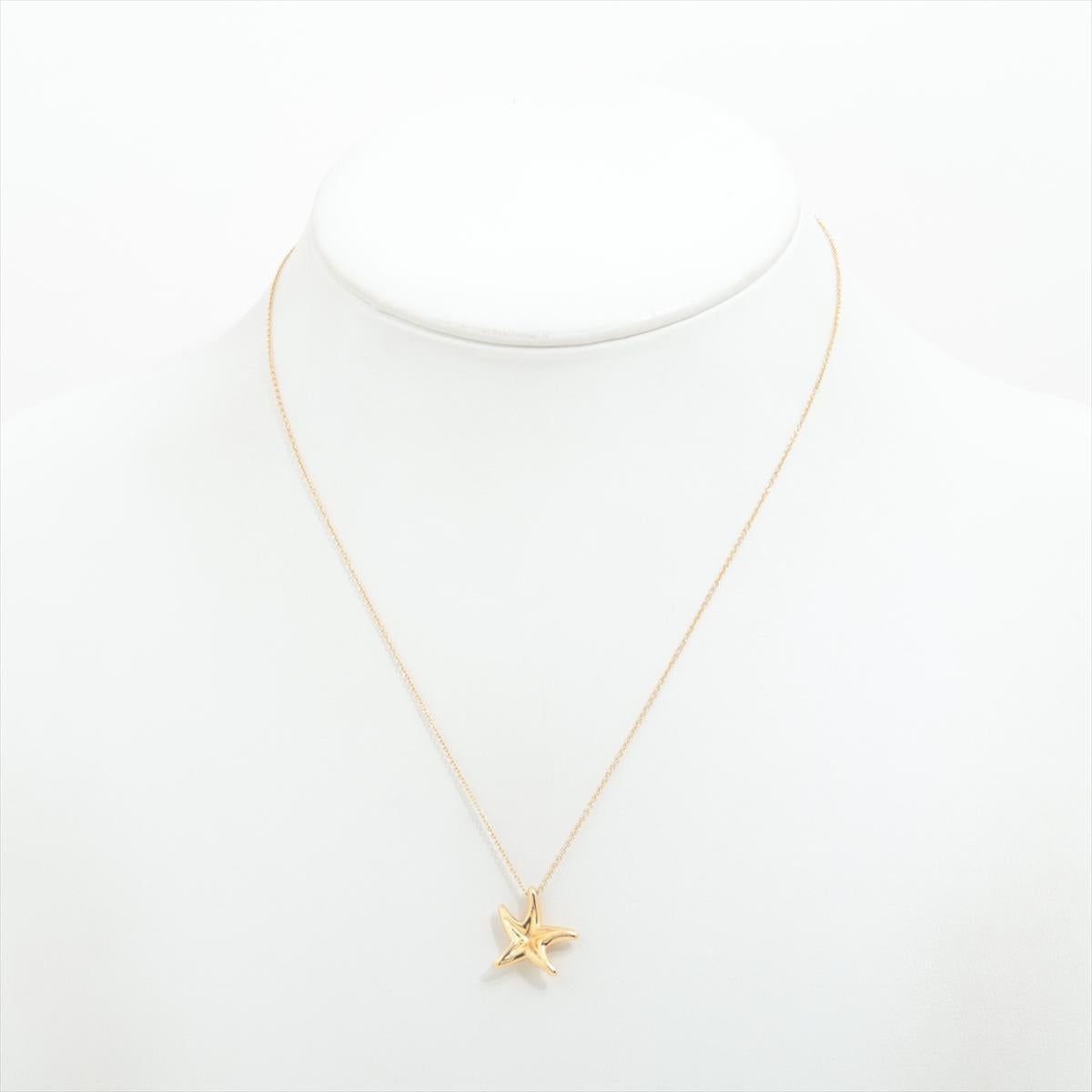 Lovely Find. PRE-OWNED Authentic Tiffany and Co 18kt Yellow Gold pendant with 18kt Yellow Gold Chain.

StarFish Pendant by Peretti

18k 750 Star Fish Pendant.

Chain is marked 750, Tiffany & Co., Peretti Spain 16 inches in length.
14mm by 15mm