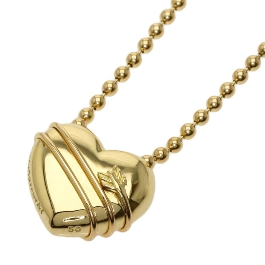 TIFFANY & Co. Collar de oro de 18 quilates con flecha de Cupido y colgante de corazón con cadena de cuentas

Metal: Oro amarillo de 18 quilates
Cadena: cadena de cuentas de 18
Colgante: 20 mm (0,79