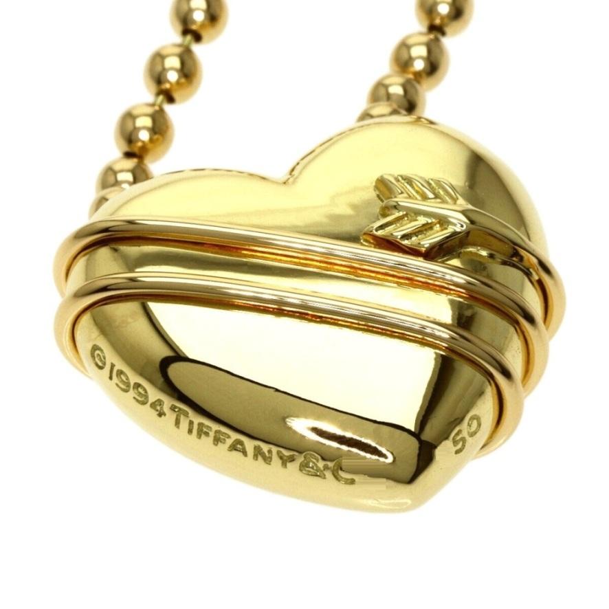 De las mujeres TIFFANY & Co. Collar de oro de 18 quilates con flecha de Cupido y colgante de corazón con cadena de cuentas en venta