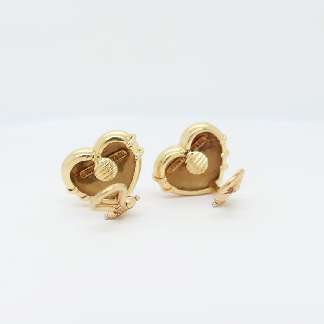Tiffany & Co. 18K Gold Cupid Arrow Heart Shaped Clip Earrings In Good Condition For Sale In Philadelphia, PA
