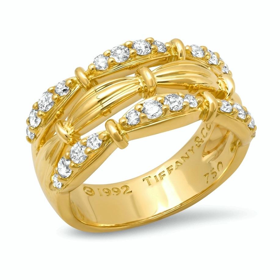 TIFFANY & Co. 18K Gold Diamond 3 Row Signature Ring 7
 
 Metal: 18K Yellow Gold
 Size: 7
 Width: 11mm at the widest point on the top
 Weight: 8.30 grams
 Diamond: 24 round brilliant diamonds, carat total weight .36
 Hallmark: ©1992 TIFFANY&Co. 750
