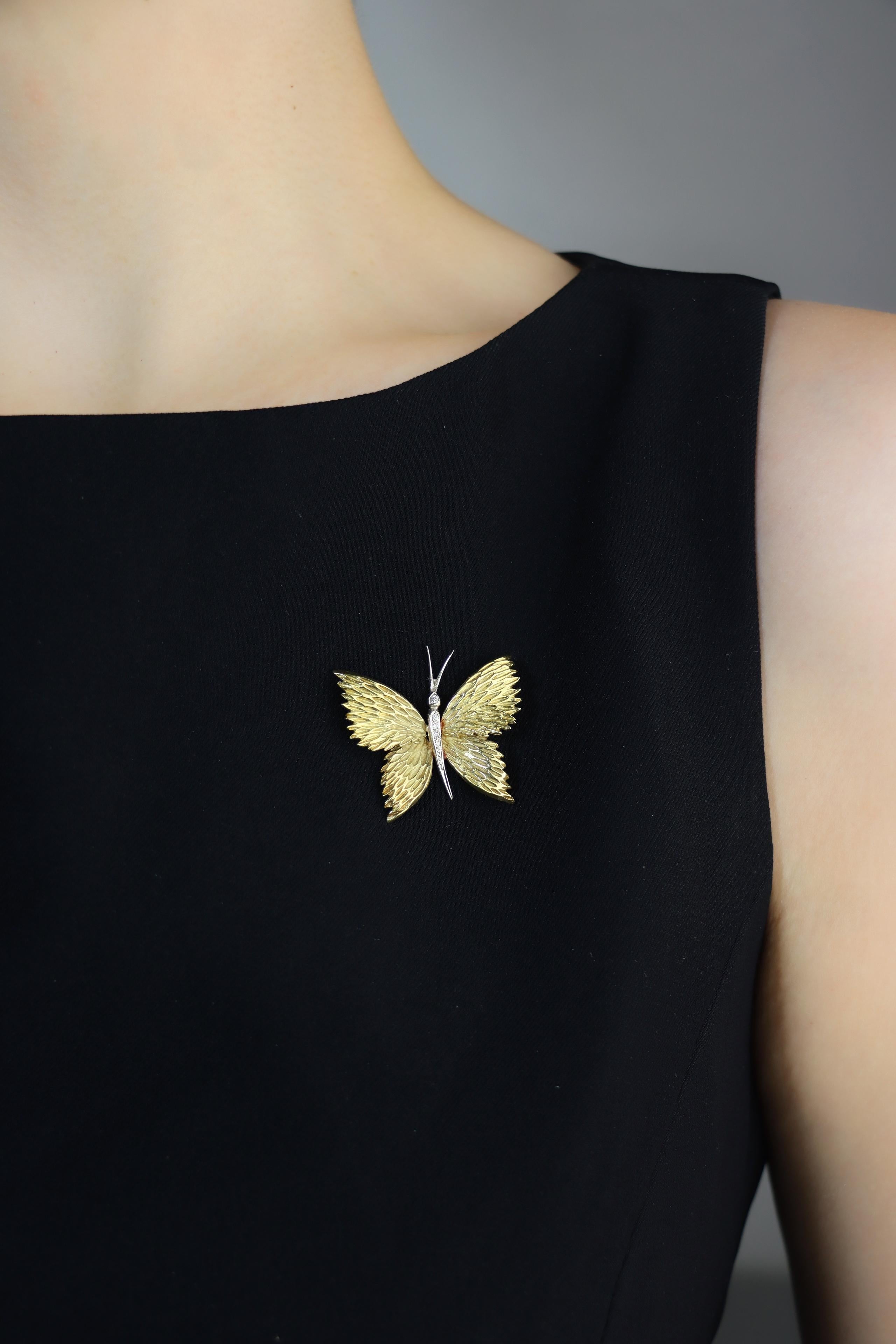 Tiffany & Co. 18K Gold Diamond Butterfly Brooch

Marked:
TIFFANY & Co
18K

Approximate Dimensions:
2.8 cm (Length)
3.3 cm (Width)
7.0 grams in weight.