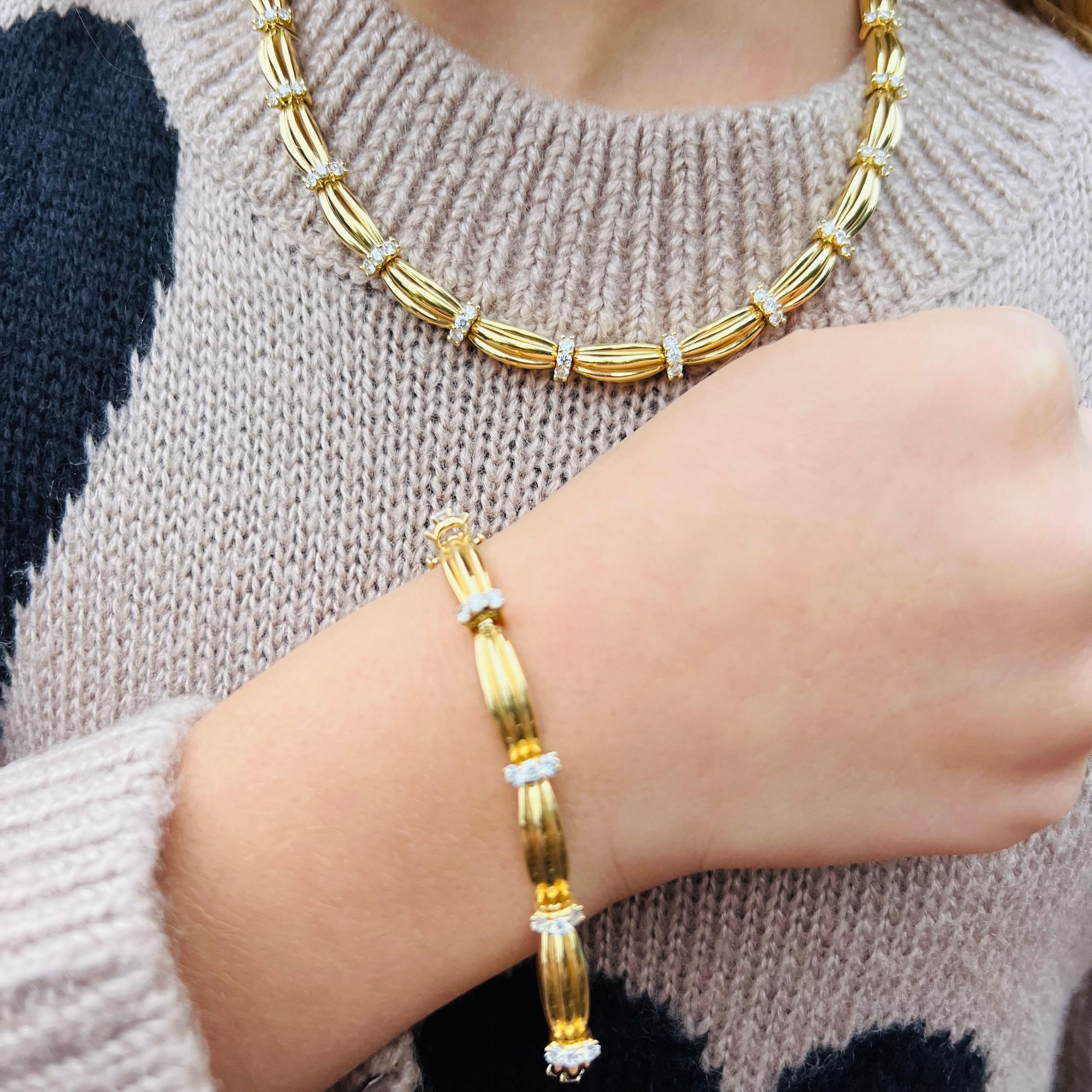 Perfectly elegant, and everything you want a Tiffany set to be! Made in 1992, this convertible 18k gold necklace and bracelet set is designed with fluted links, joined by trios of round brilliant-cut diamonds, weighing in total an estimated 6.00