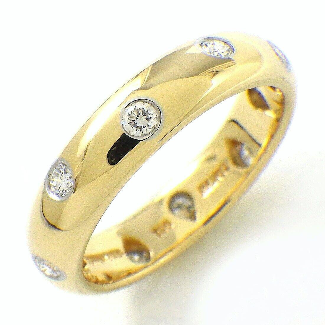 TIFFANY & Co. 18K Gold Diamond Etoile 4mm Band Ring 5

Metal: 18K Gold
Size: 5 
Band Width: 4mm
Diamond: 10 round brilliant diamonds, carat total weight .22
Hallmark: TIFFANY&CO. 750 PT950 
Condition: Excellent condition, like new

Authenticity