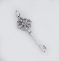 Tiffany & Co. 18k Gold Diamond Knot Key Pendant Charm