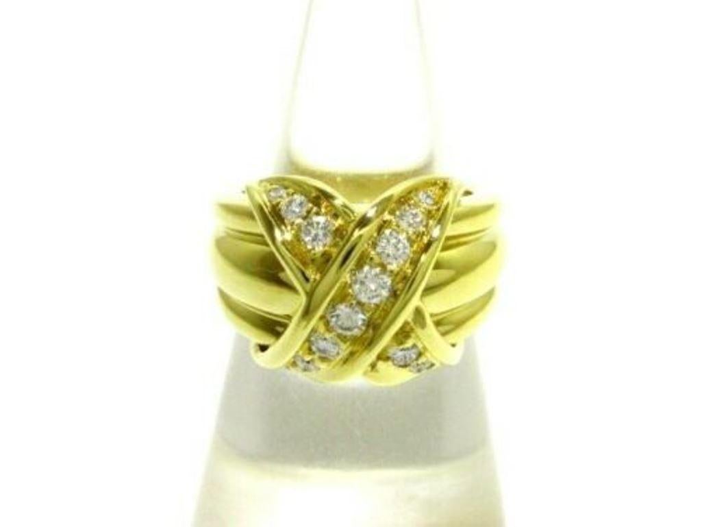 TIFFANY & Co. 18K Gold Diamond Signature X Ring 5
 
 Metal: 18K Yellow Gold
 Size: 5
 Width: 13mm at the widest point
 Weight: 11.80 grams
 Diamond: 14 round brilliant diamonds, carat total weight .35
 Hallmark: 750 ©1990 TIFFANY&Co.
 Condition:
